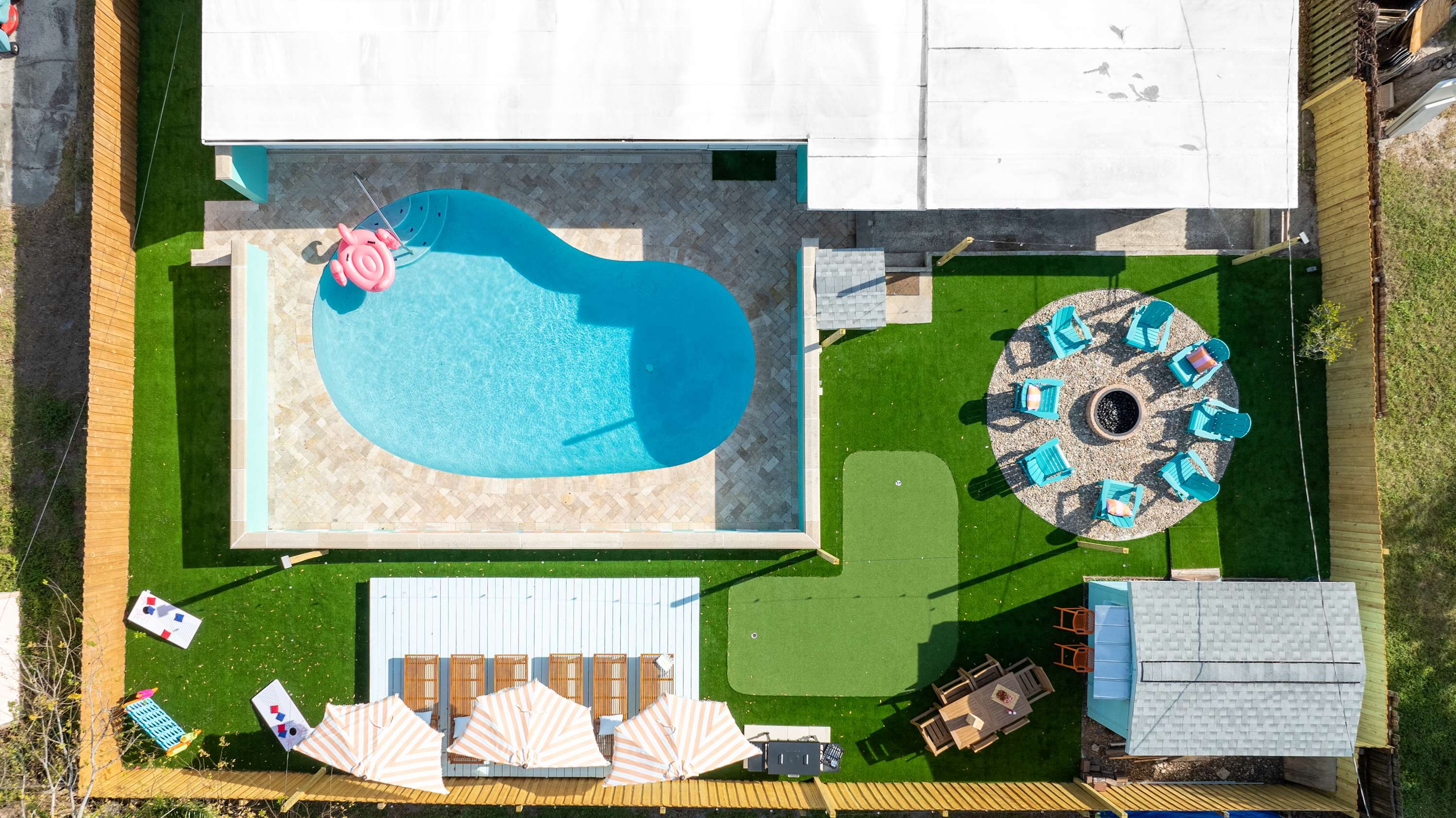 Top-down view of the pool & yard showcasing the spacious outdoor layout.