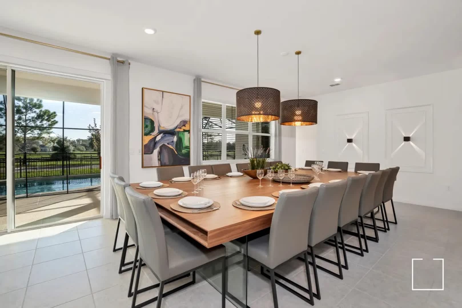 Spacious dining room with stunning pool views, perfect for hosting memorable gatherings.