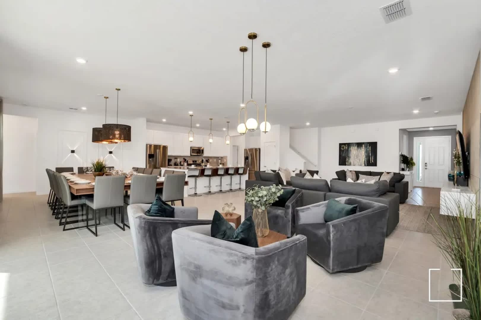 Experience luxury in this expansive open-plan living space, perfect for entertaining with its modern decor and ample seating.