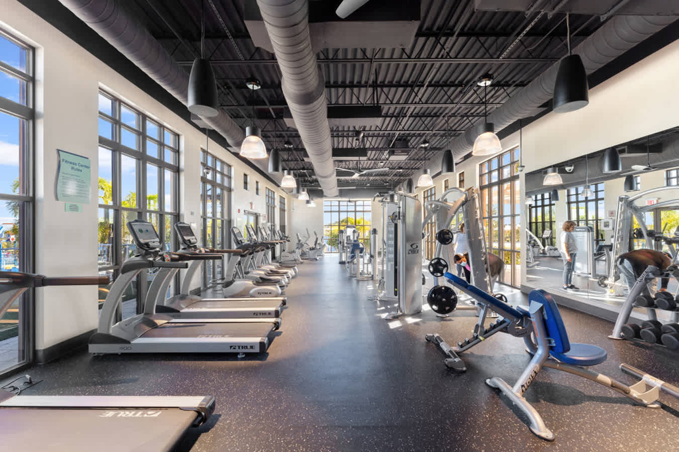 Fully Equipped Gym Featuring Cardio Machines And Strength Equipment