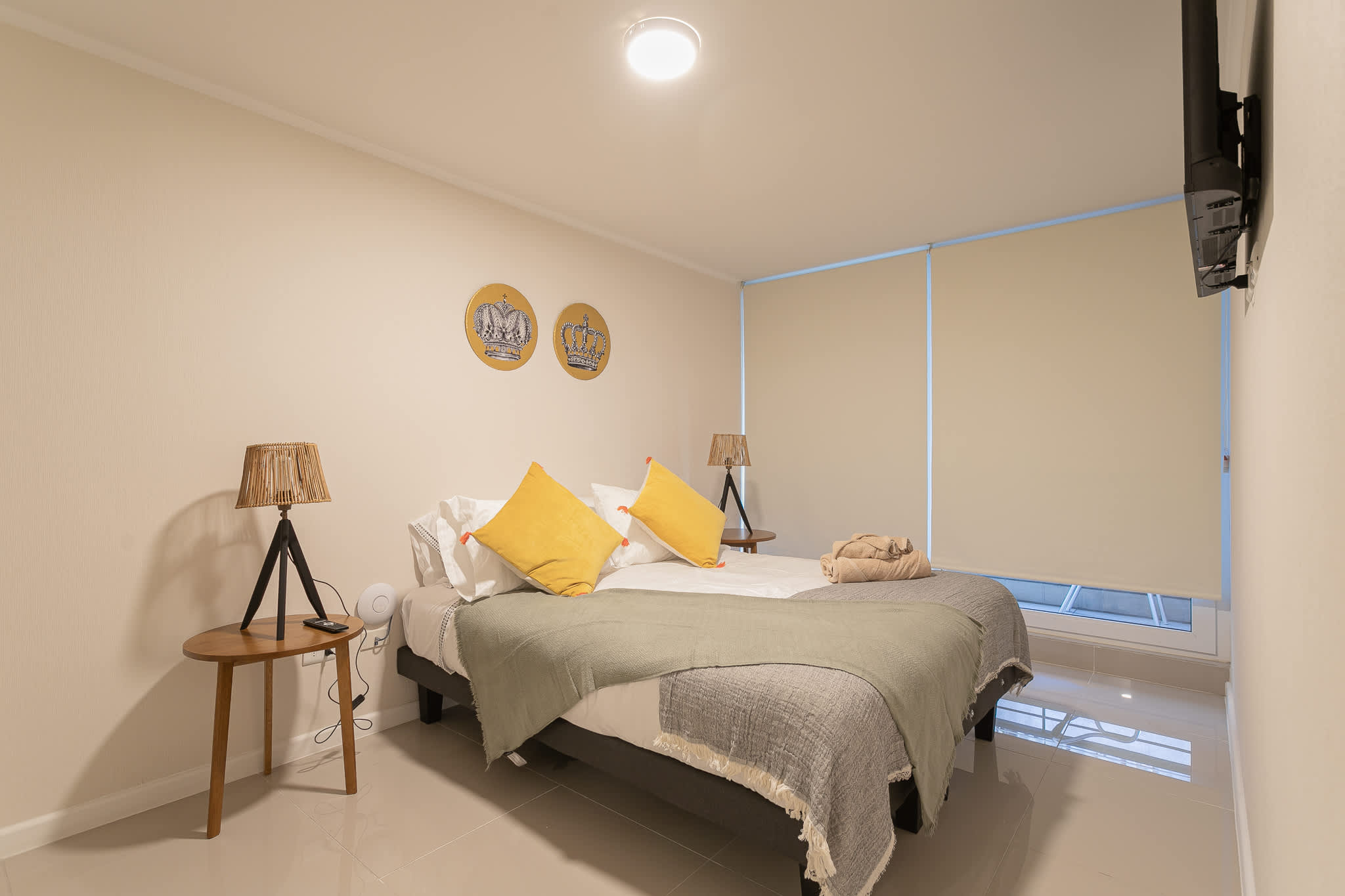Cozy bedroom with stylish decor and comfortable bedding, perfect for a restful stay.