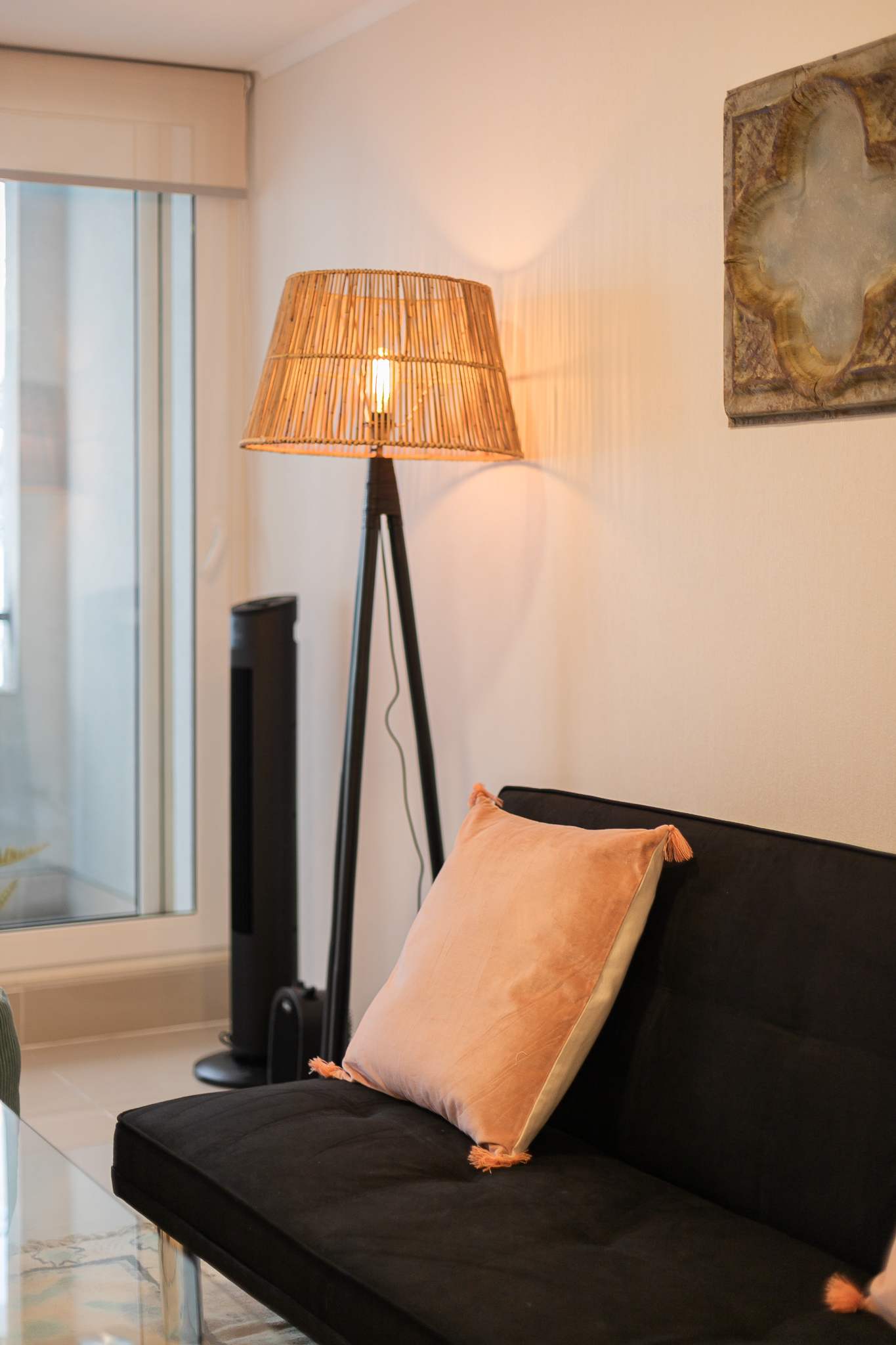 Relax in this chic and cozy living space with warm lighting and stylish decor, perfect for unwinding.