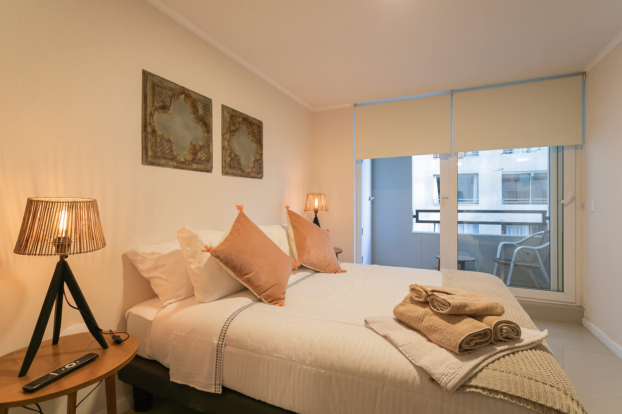 Relax in this cozy bedroom with plush bedding and a serene view, perfect for unwinding after a day of exploring.