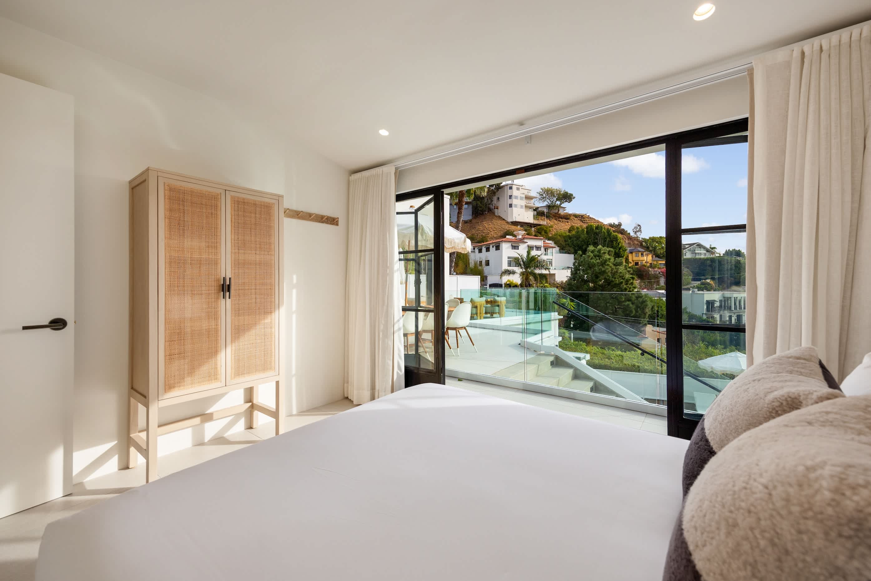 Wake up to panoramic hillside views in total comfort.