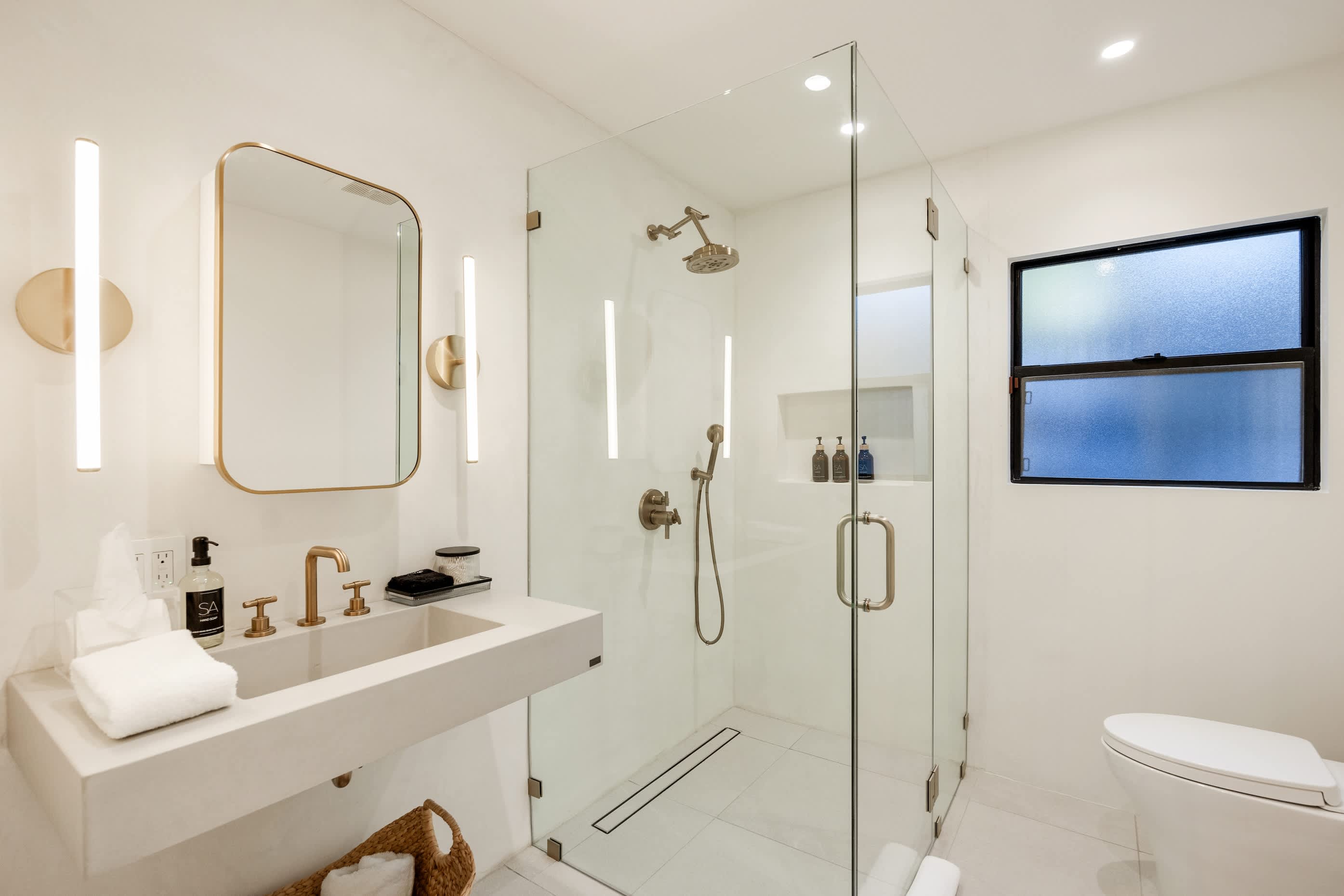 Golden accents and polished fixtures bring luxury to every moment.