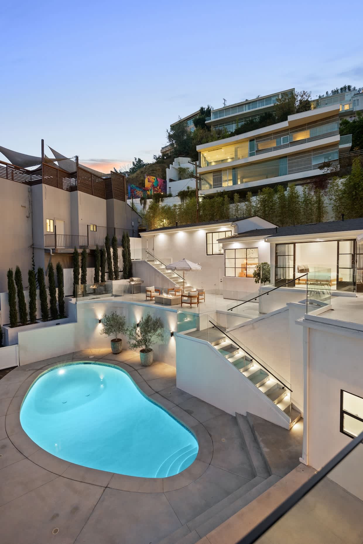 Take a dip in the sparkling pool surrounded by serene hillside views.