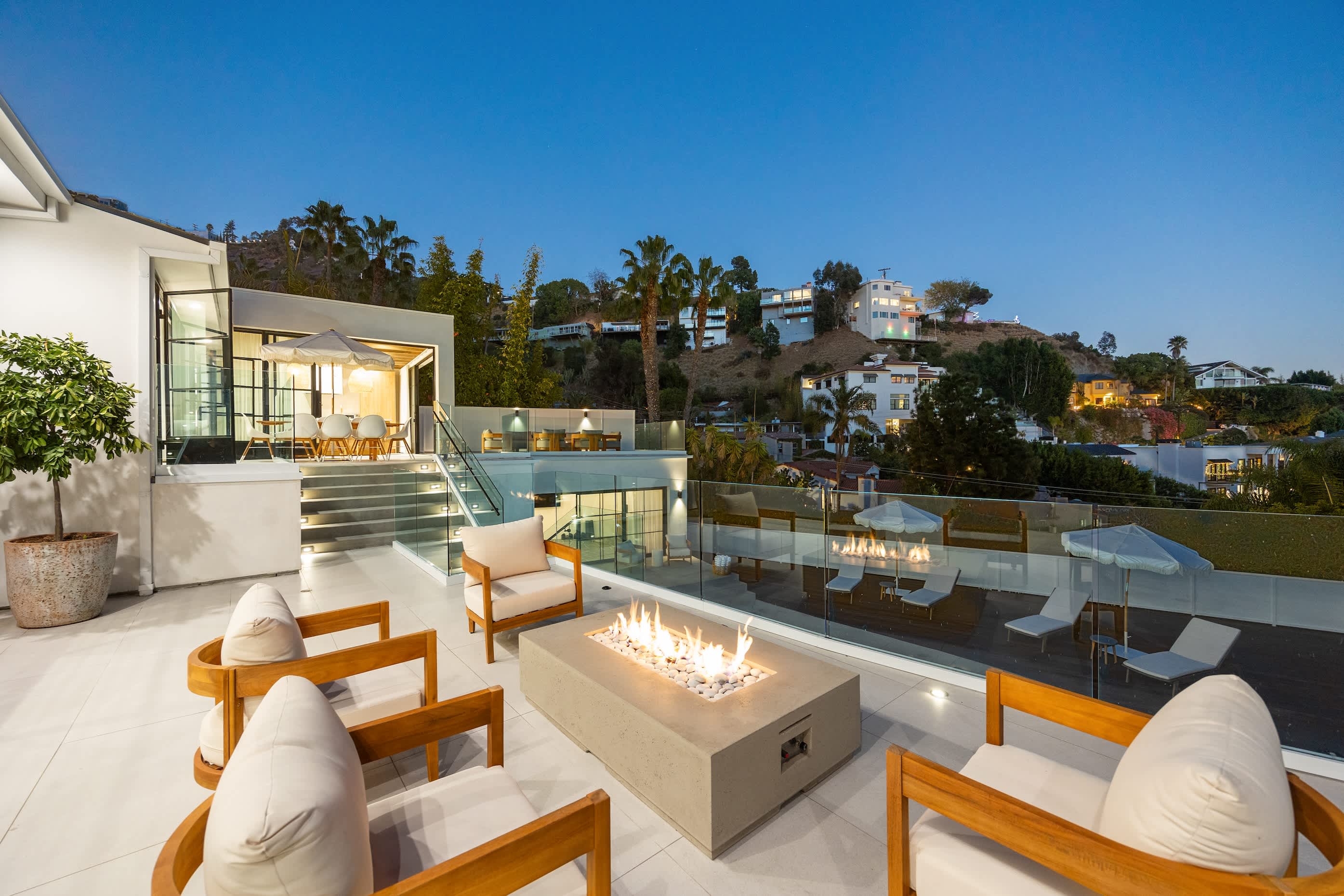 Twinkling city lights and plush seating set the tone for unforgettable nights