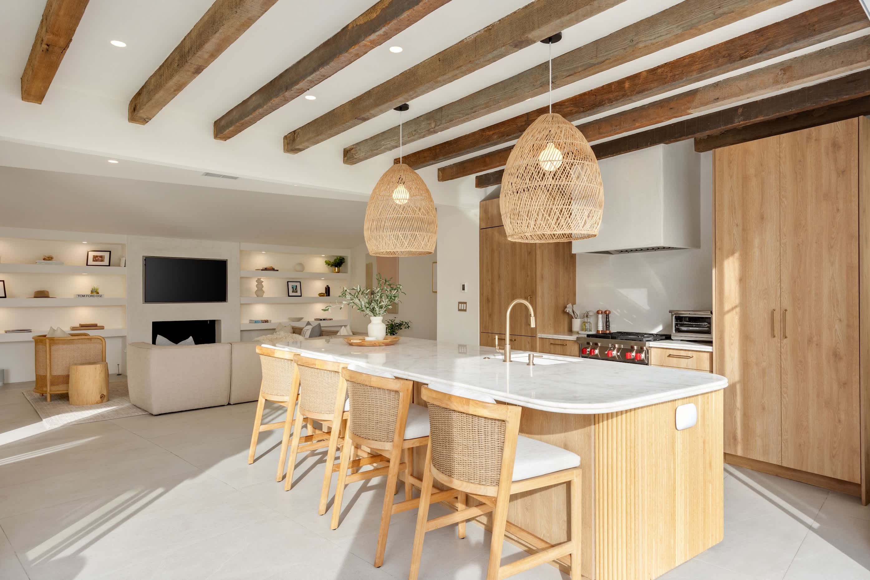 Polished stone countertops and integrated appliances make this kitchen a dream.