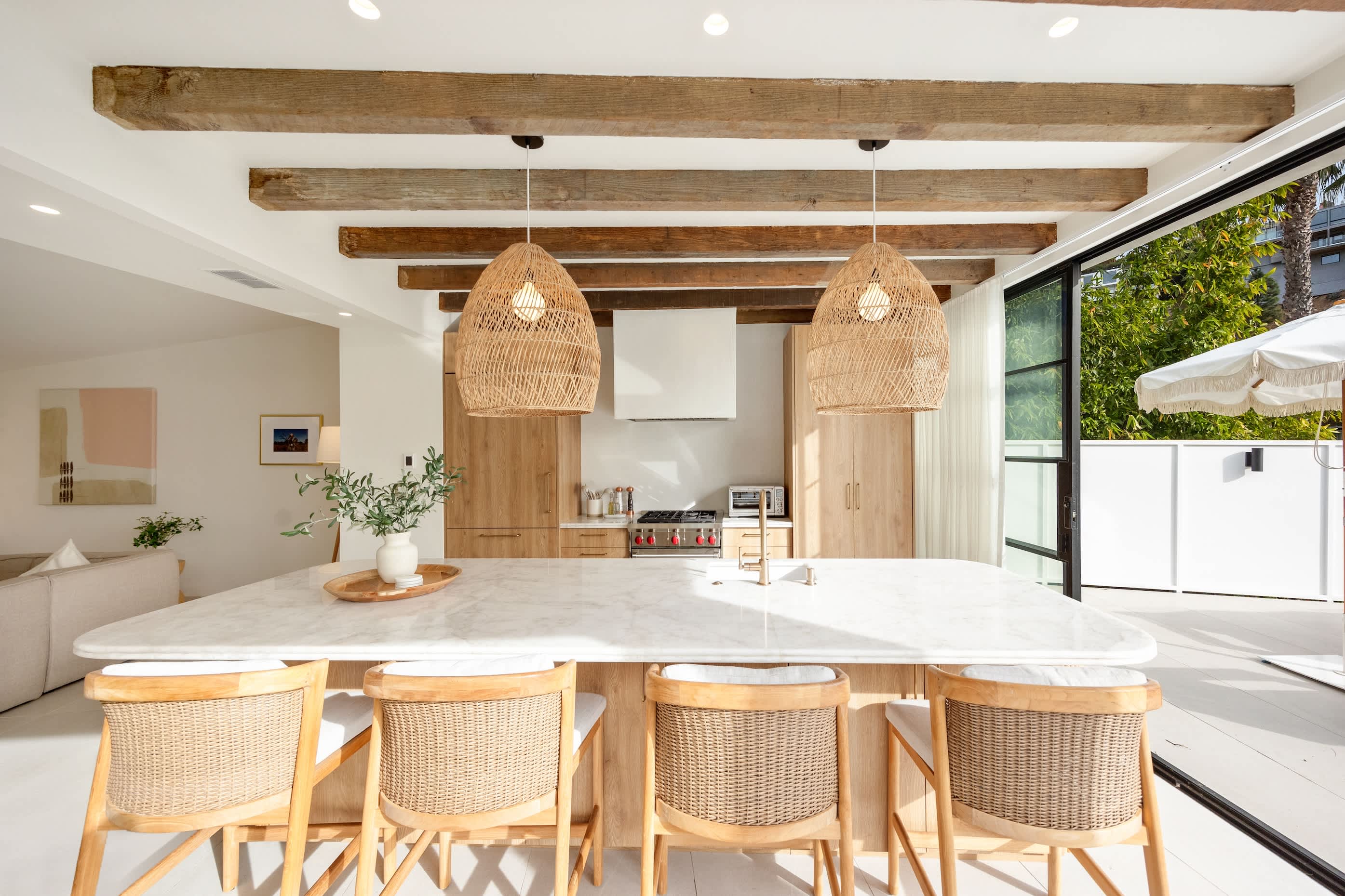 Floor-to-ceiling doors seamlessly blend indoor and outdoor living.