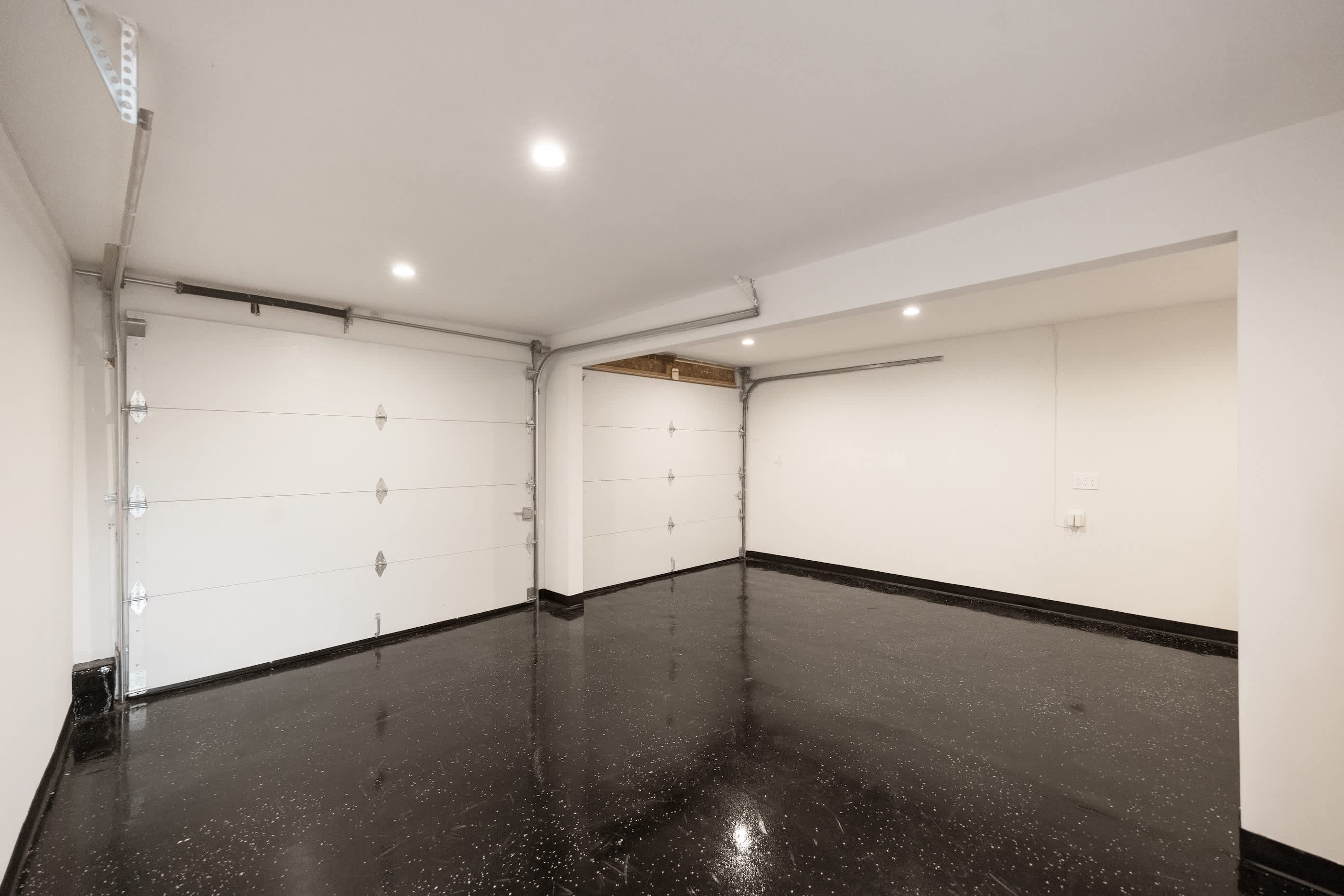 A spacious, polished garage ready for secure parking or extra storage.