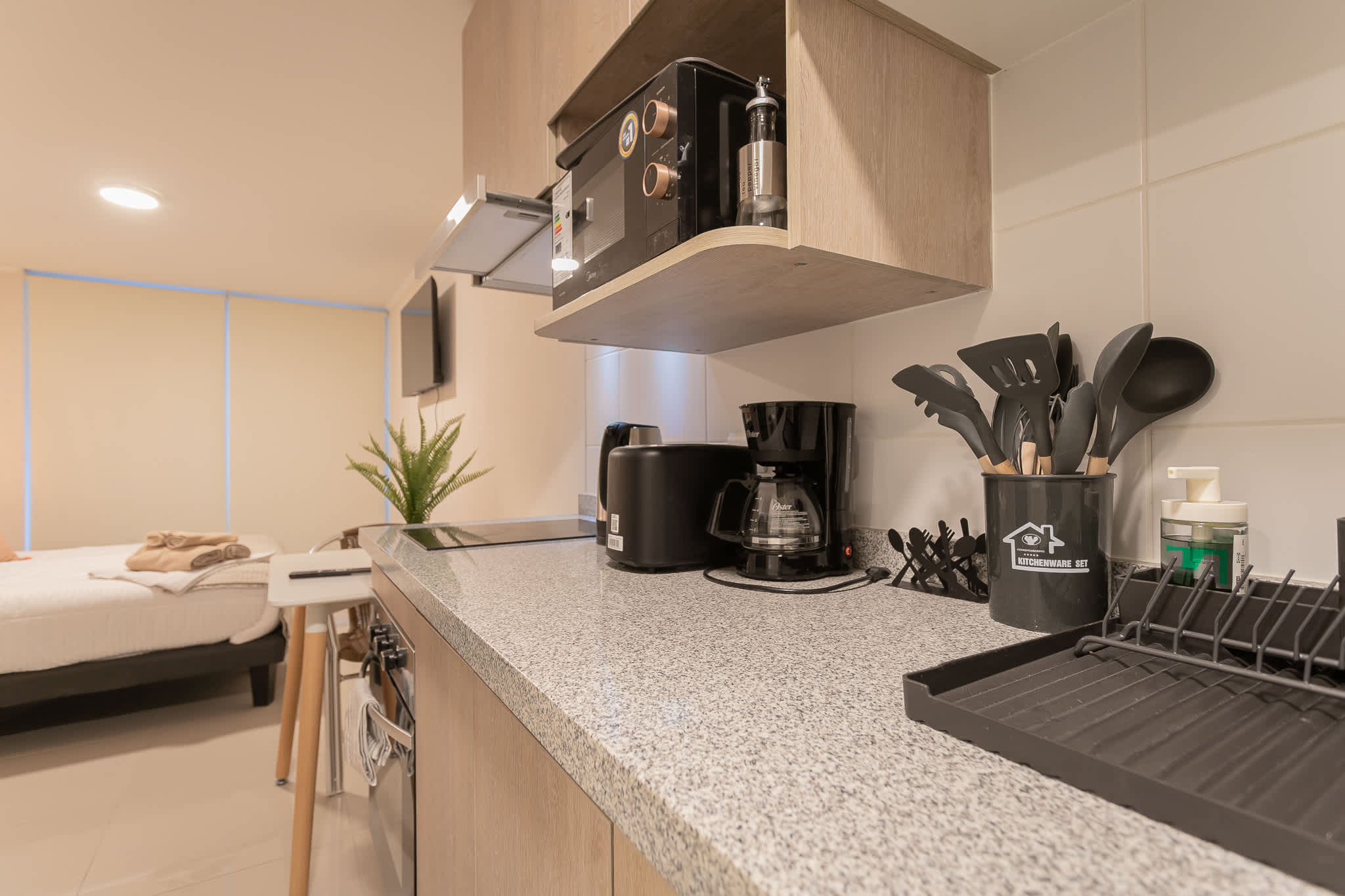 Modern kitchen with sleek appliances and ample counter space, perfect for preparing meals during your stay.