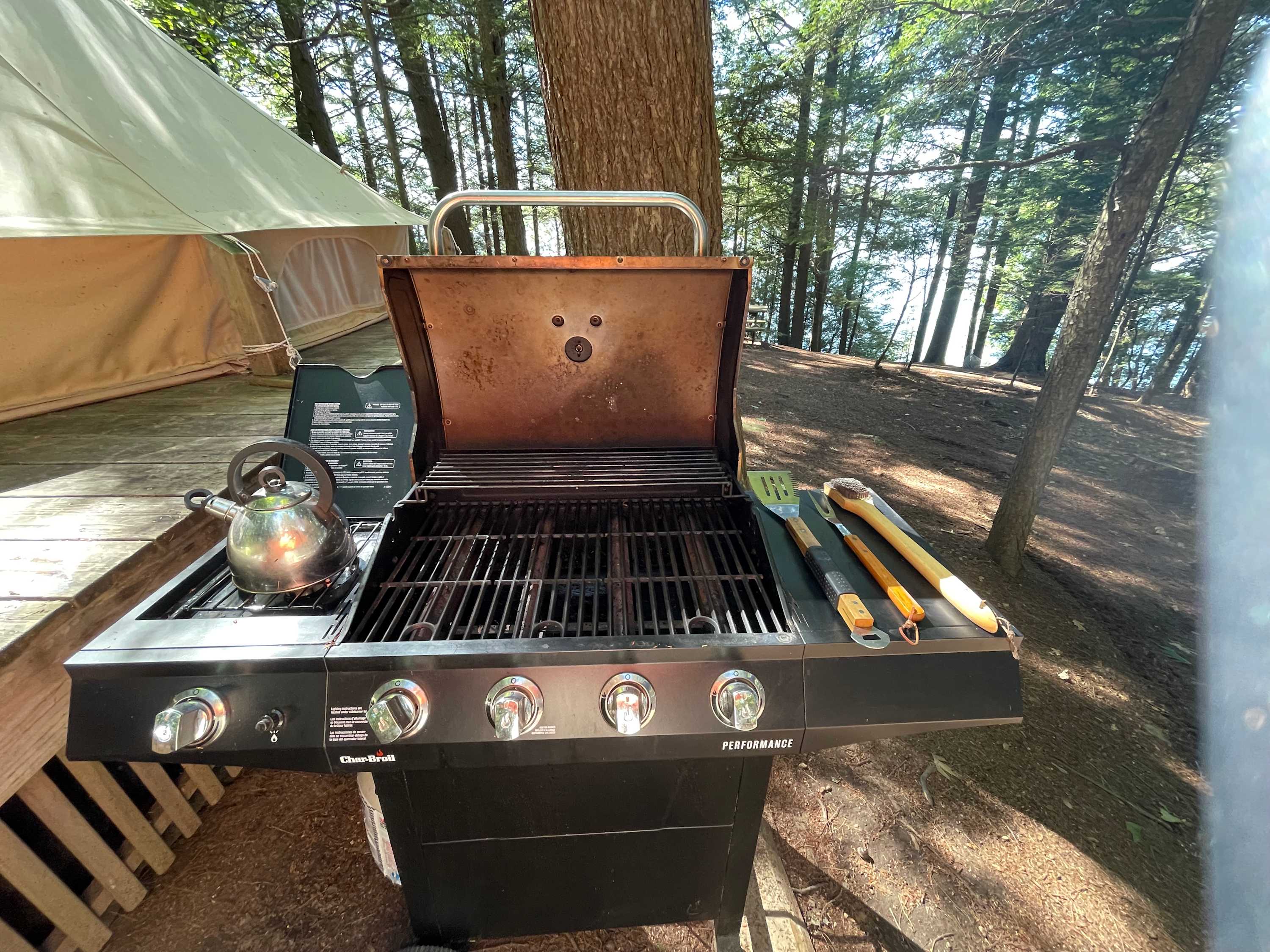 Cooking options include this grill (with side burner), or cooking over a campfire.