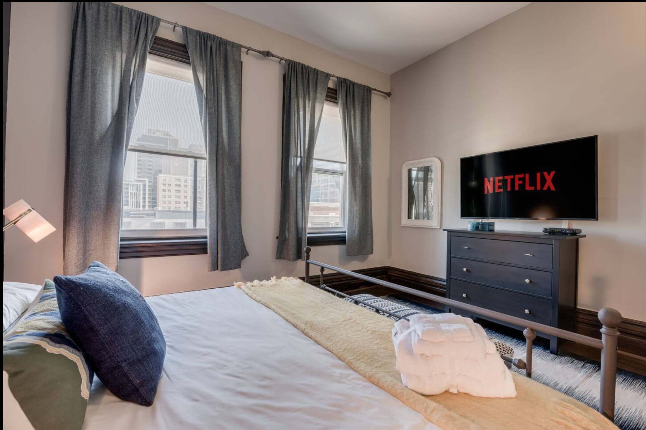 King Bedroom with Large windows and Smart TV