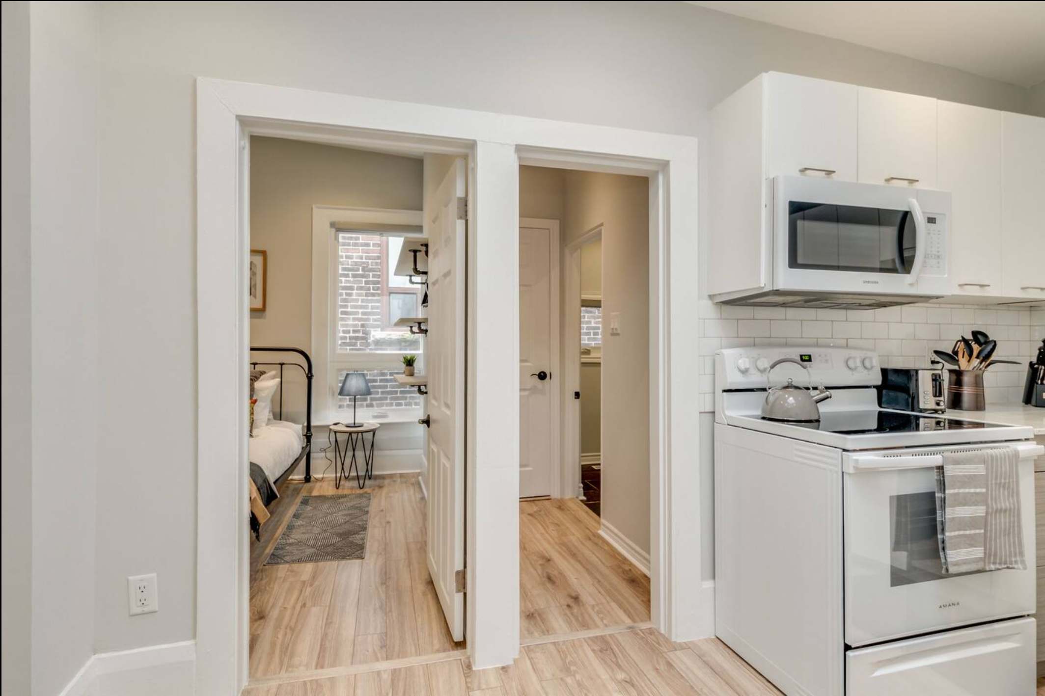 Open-concept kitchen area leading into the bedroom