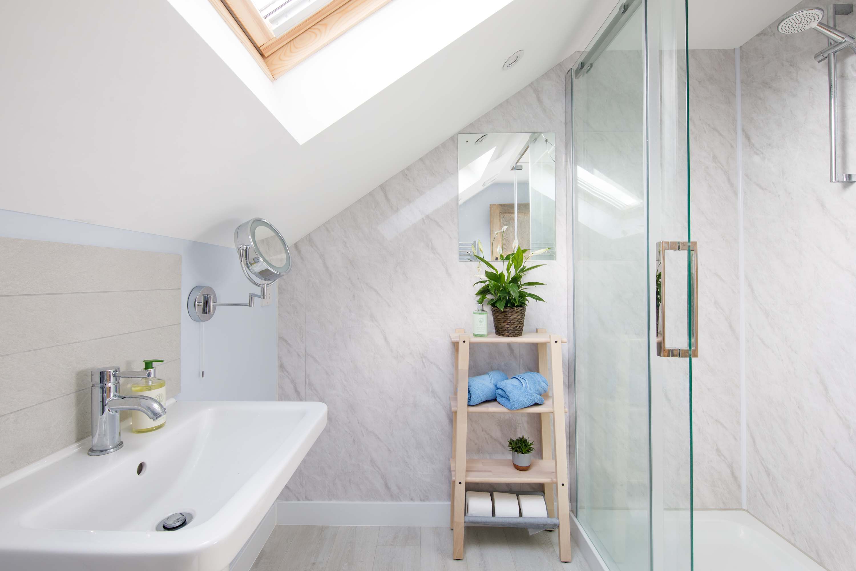 Hop in the spacious walk in shower after a day at the beach