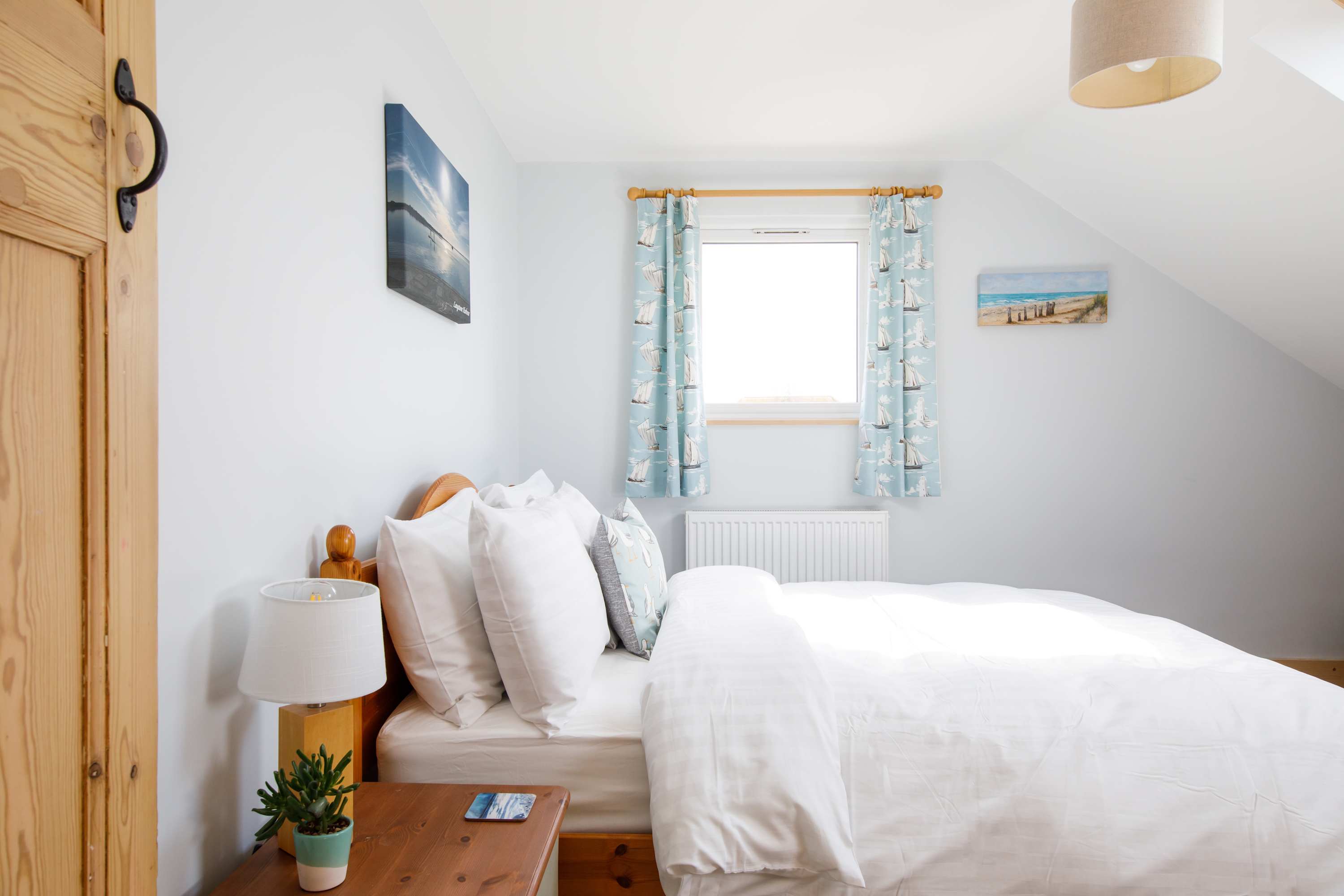 Close the curtains and sleep a bit longer or let the first sunlight wake you up