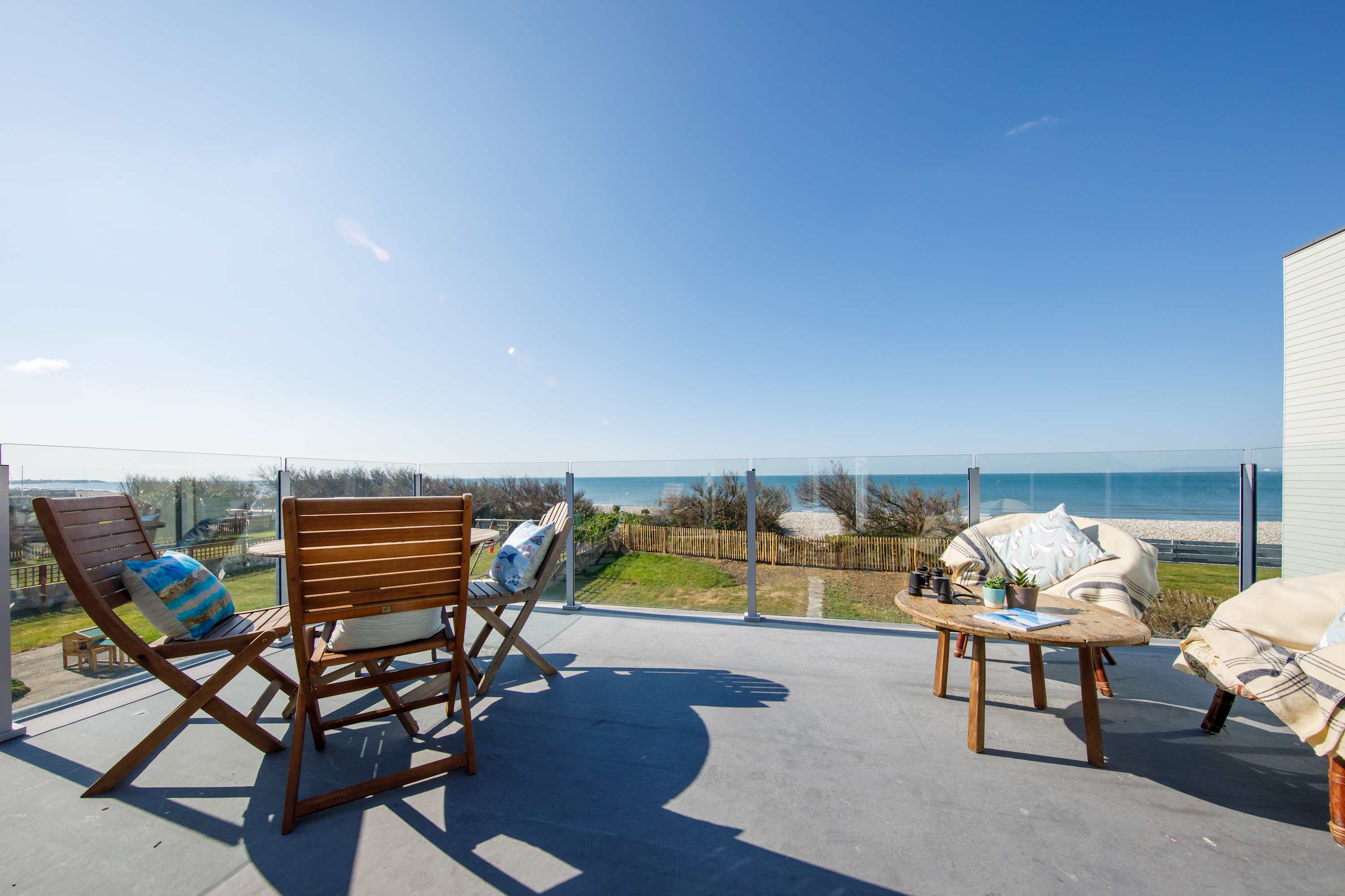Work on your tan while relaxing on the balcony