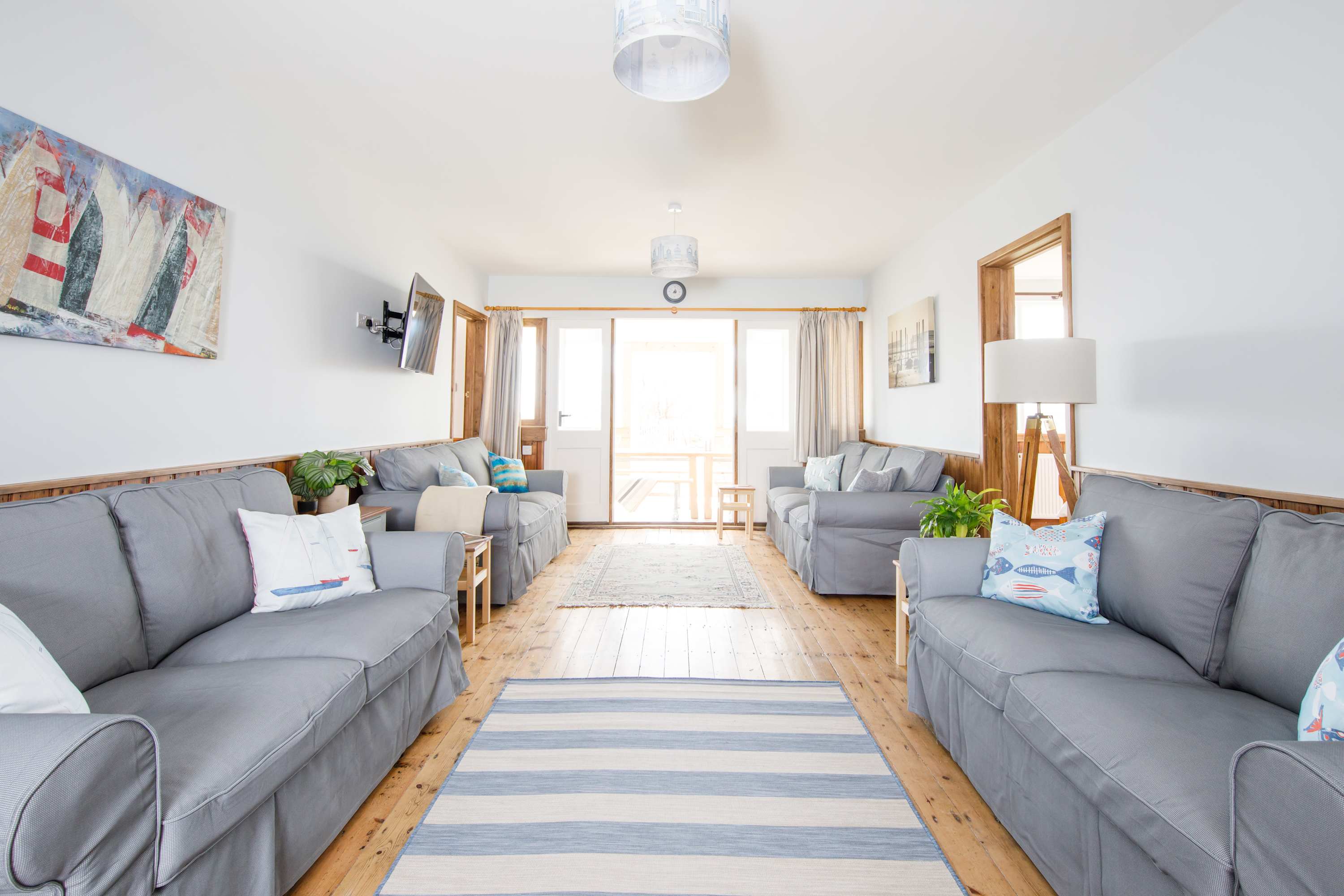 Ground floor living room connects the kitchen and the dining area