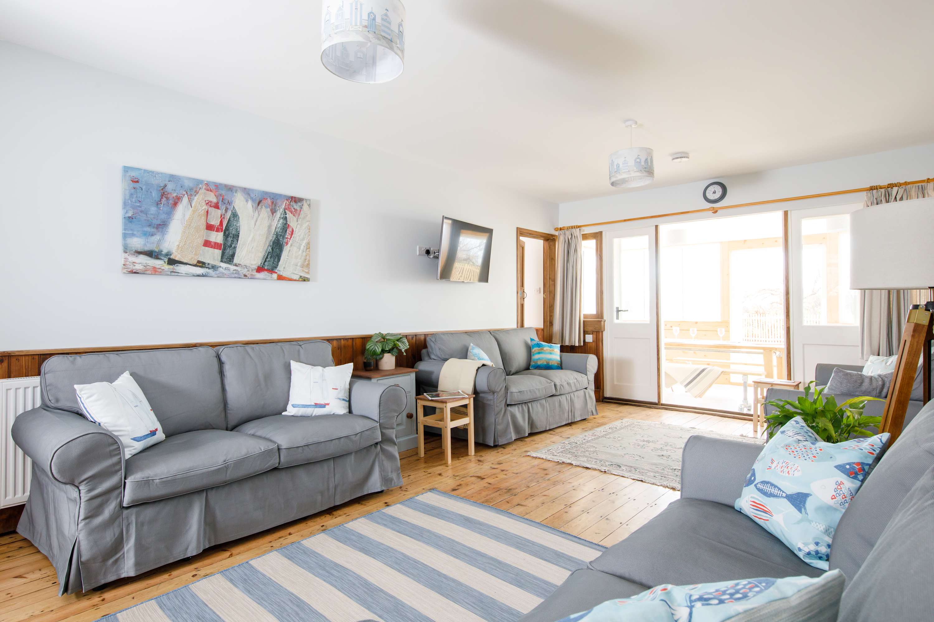 There are four comfortable sofas in the main living room