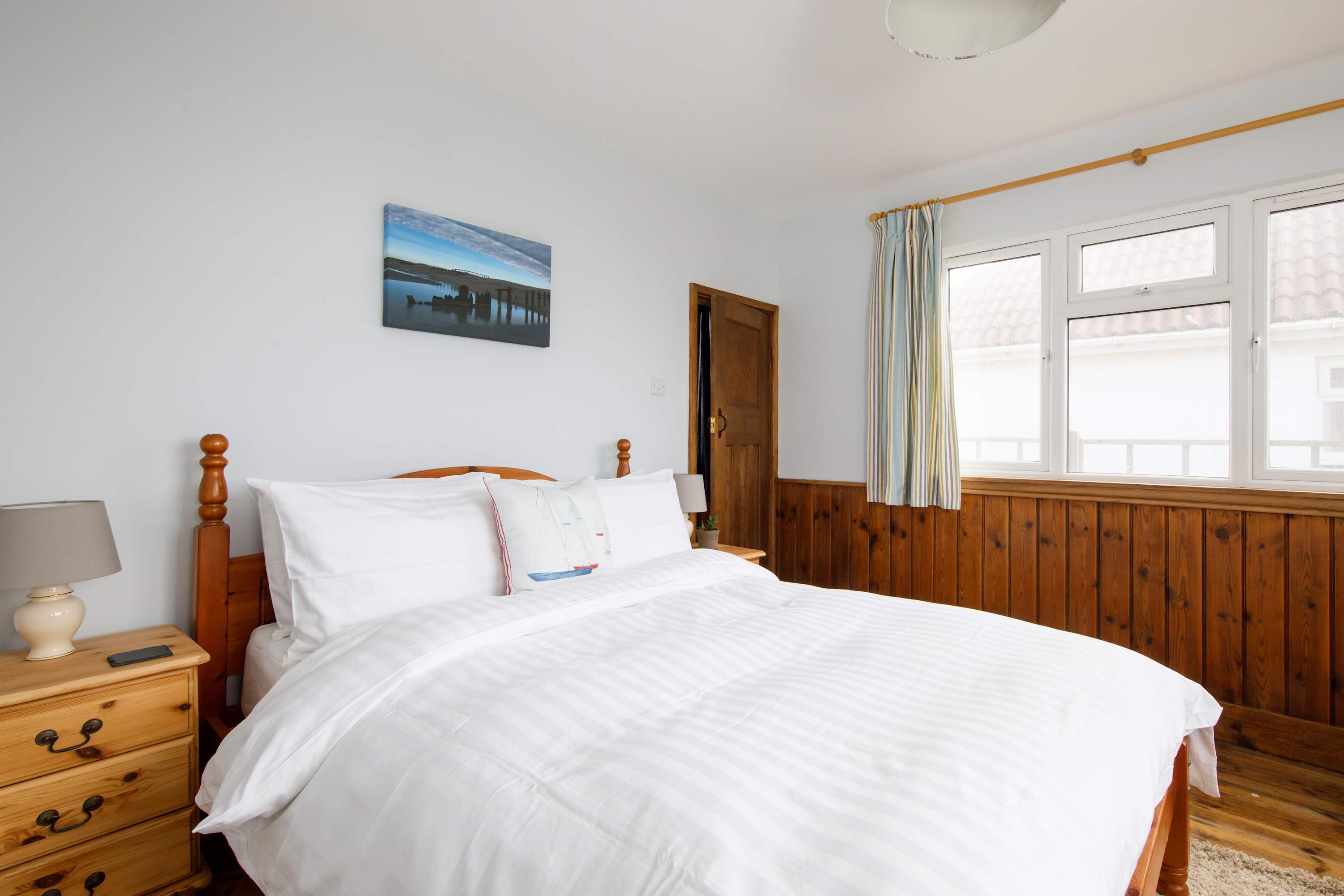 The ground floor features a total of four bedrooms