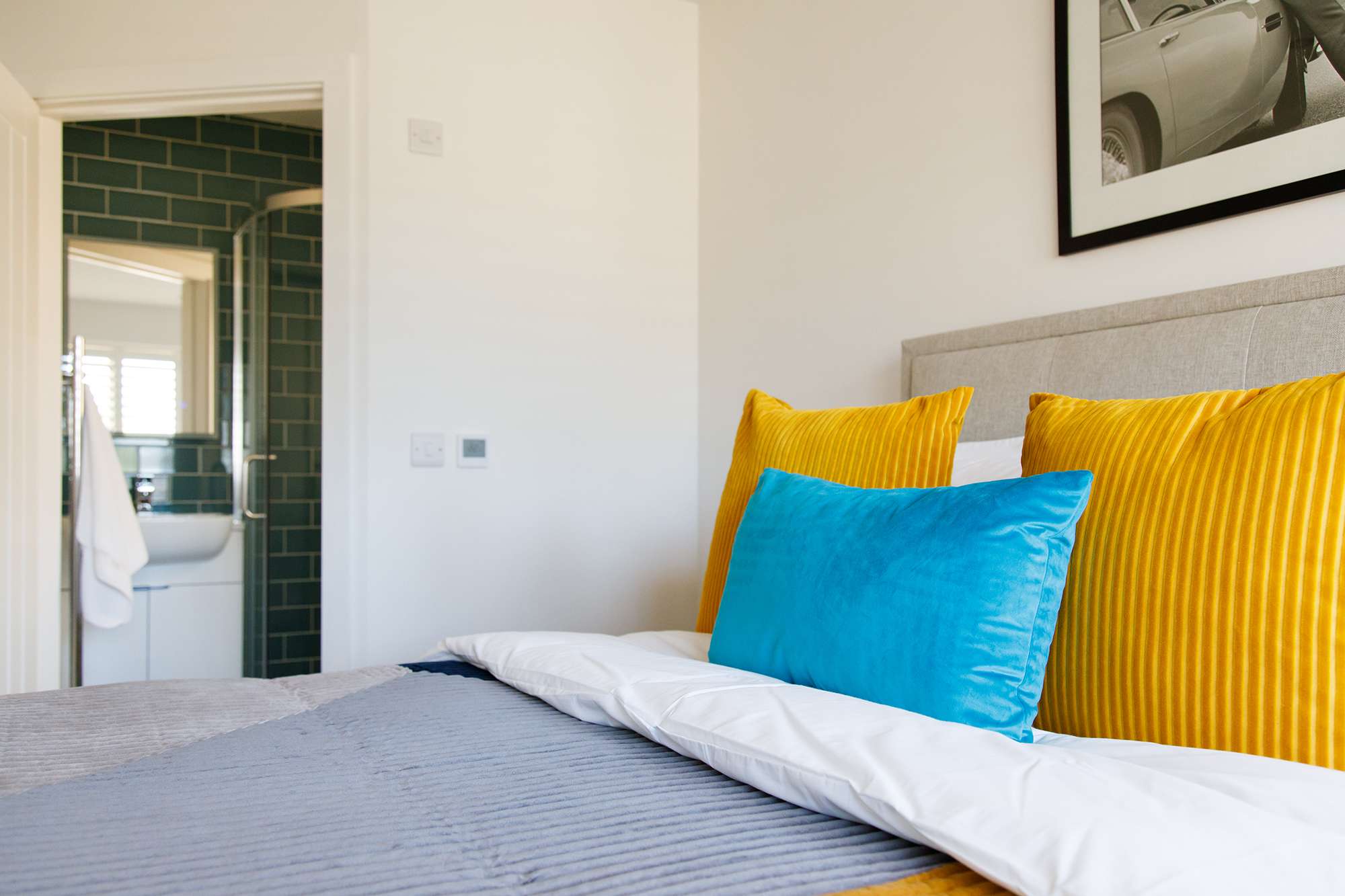 The ground floor king bedroom has luxurious bedding and throws for a comfy night's sleep.