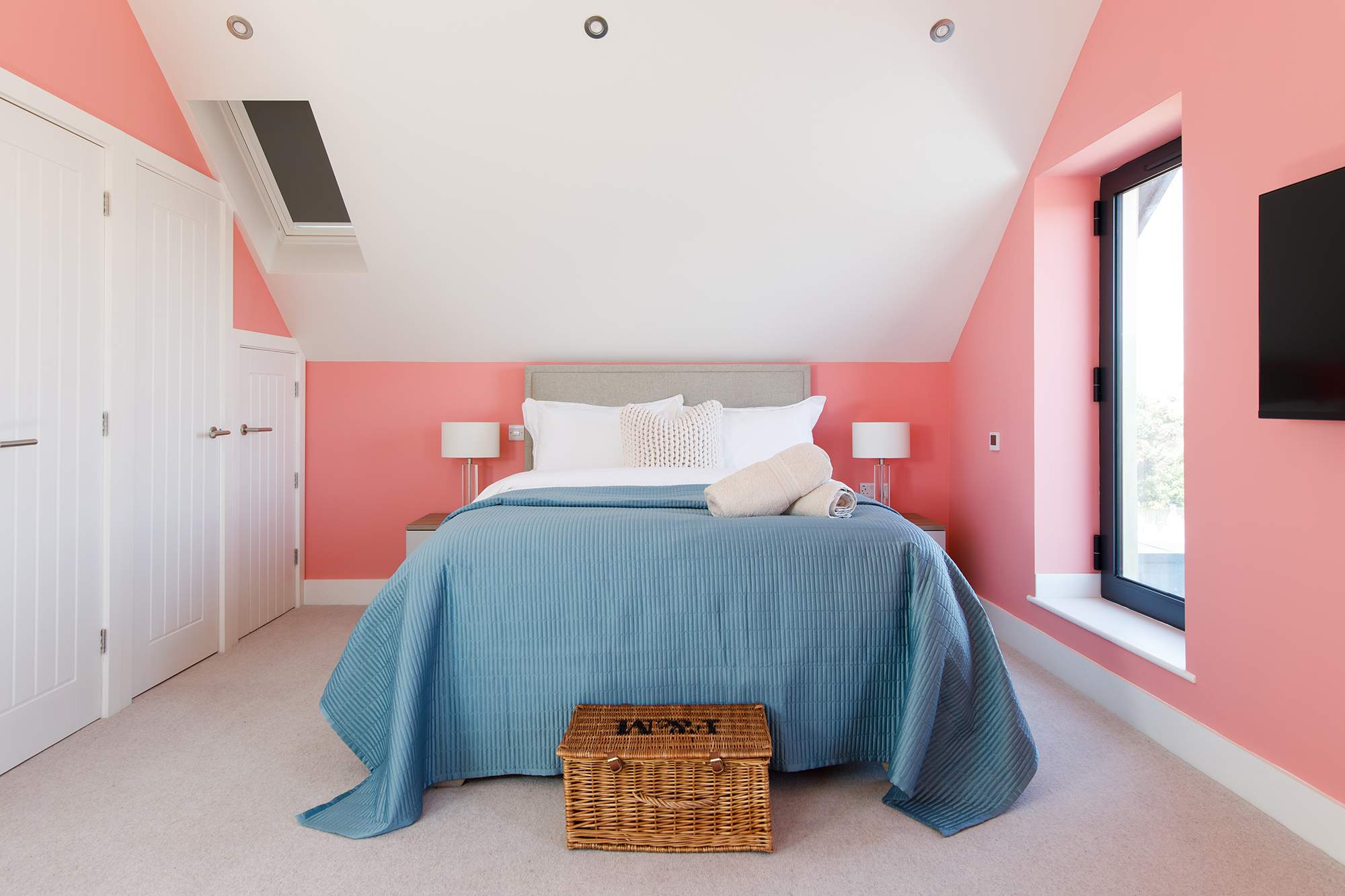 The second suite is a bright, modern room at the rear of the home.