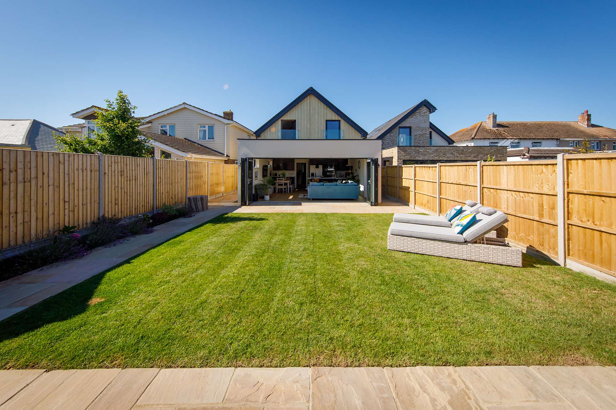 The sunny garden has sun loungers and garden furniture to enjoy al fresco dining.