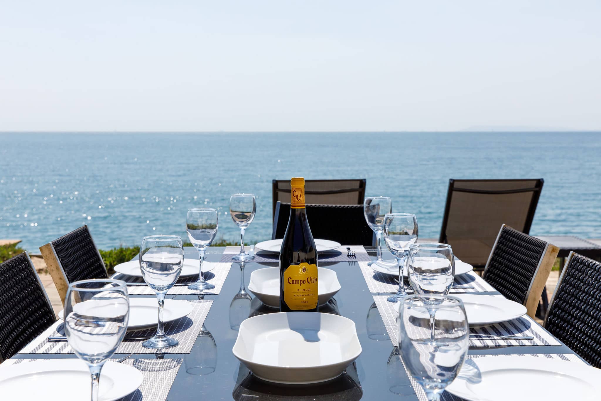 Dine to a back drop of sparkling sea and blue skies.
