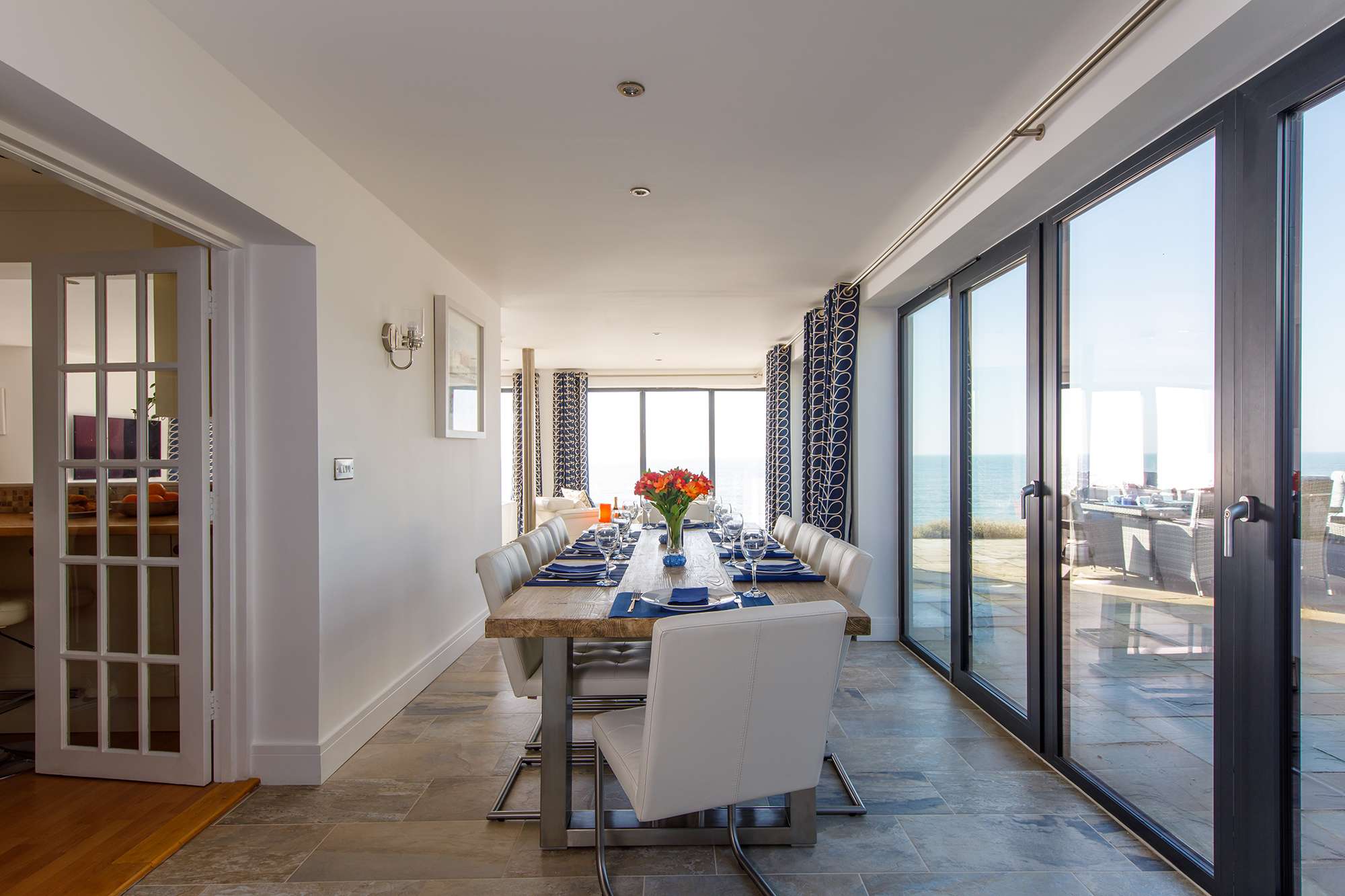 The dining room has a large table to seat up to 8 guests, with incredible views as you dine.