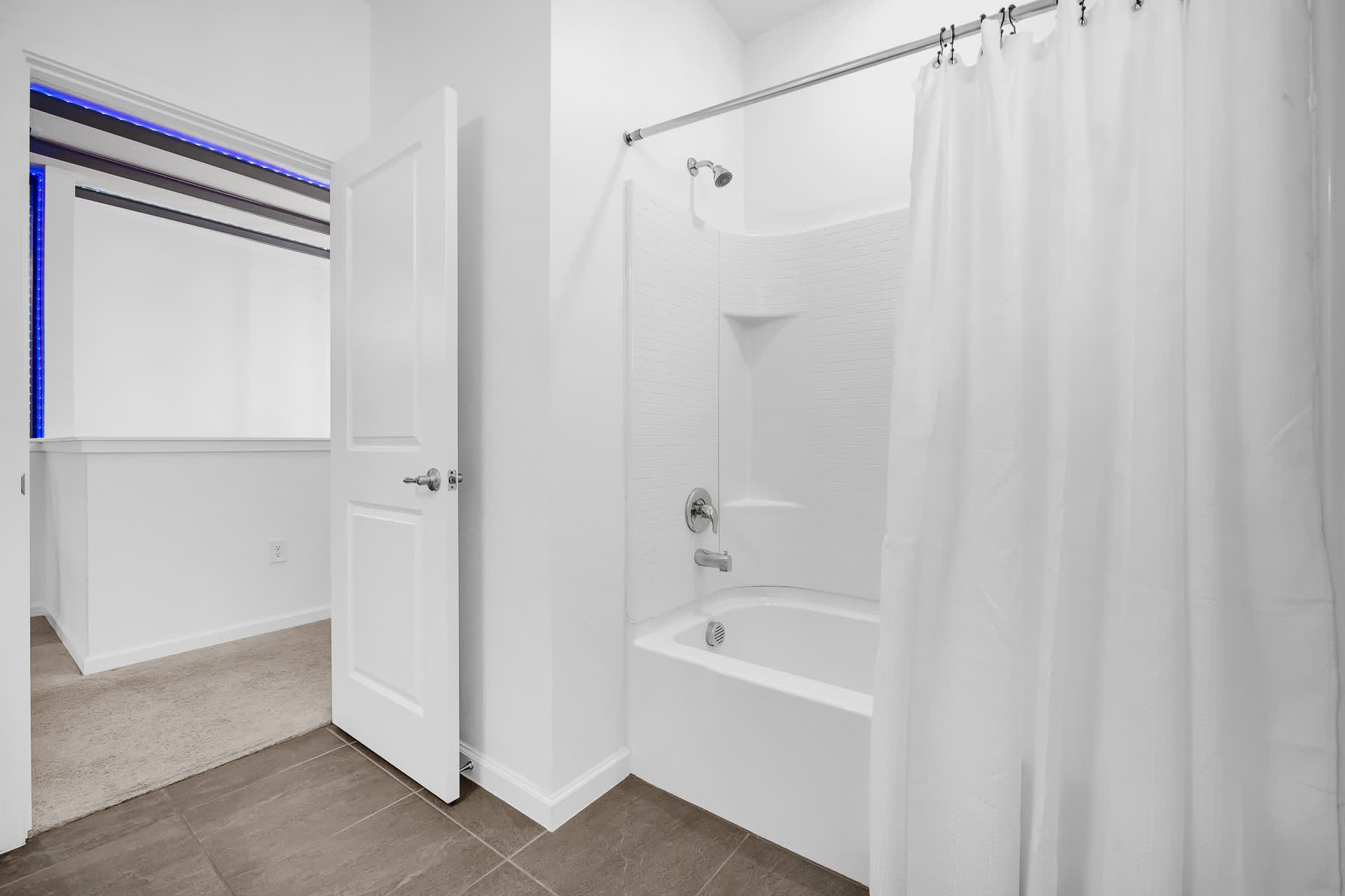 Full Shared Bathroom with Combined Bathtub and Shower