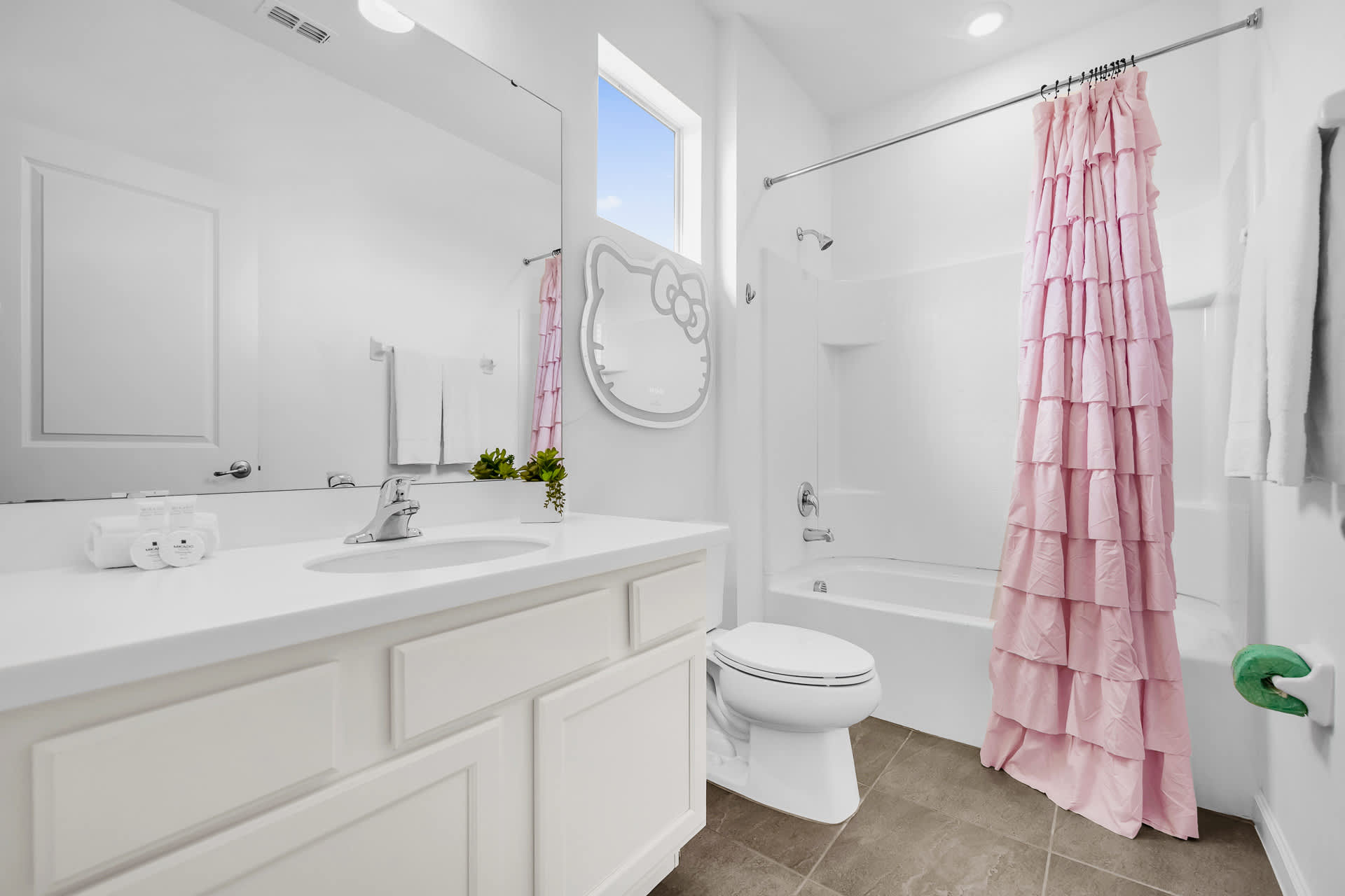 Hello Kitty Themed Kids Bathroom with Combined Bathtub and Shower