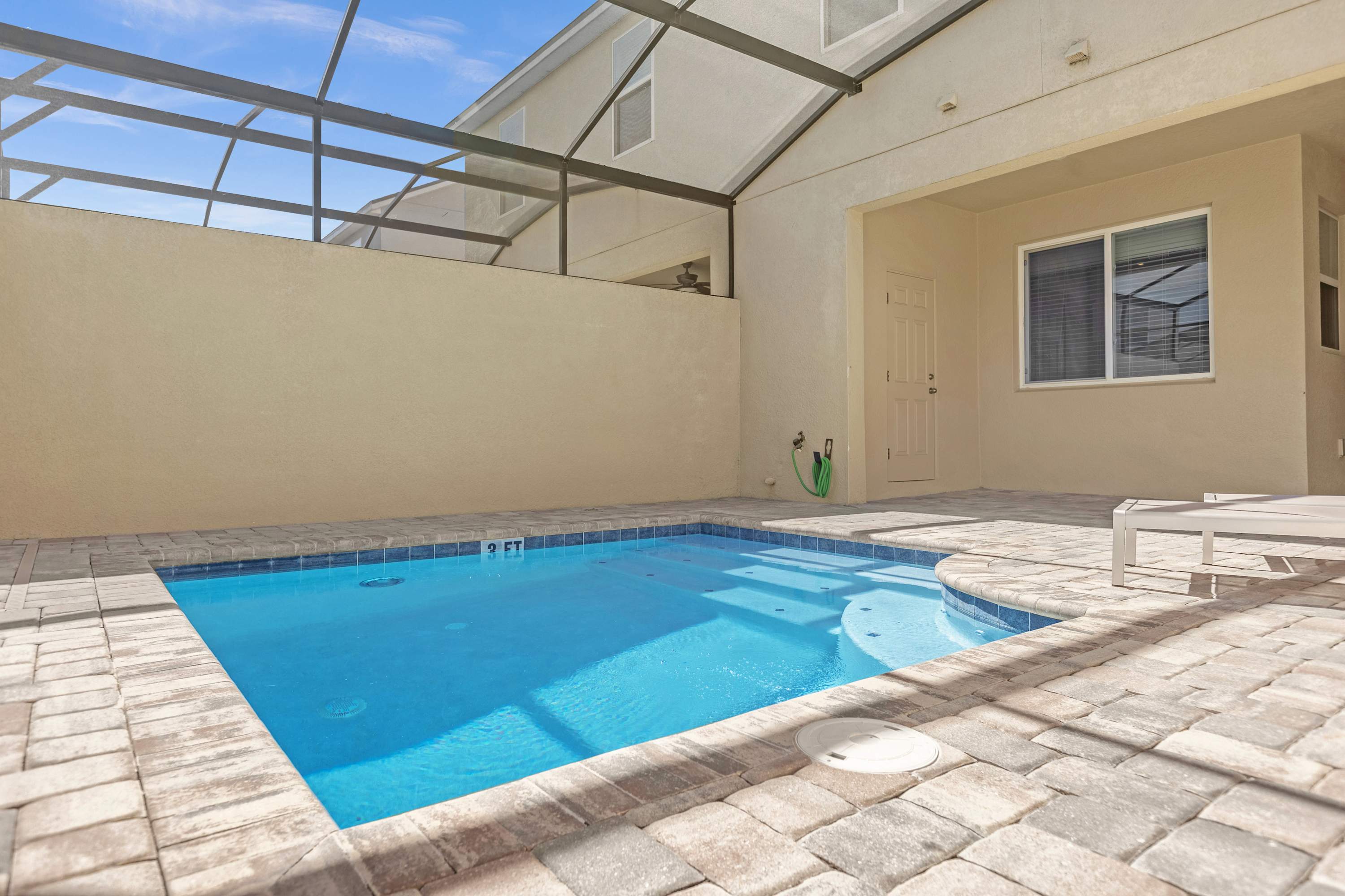 Enjoy The Sunshine In This Tranquil Poolside Space