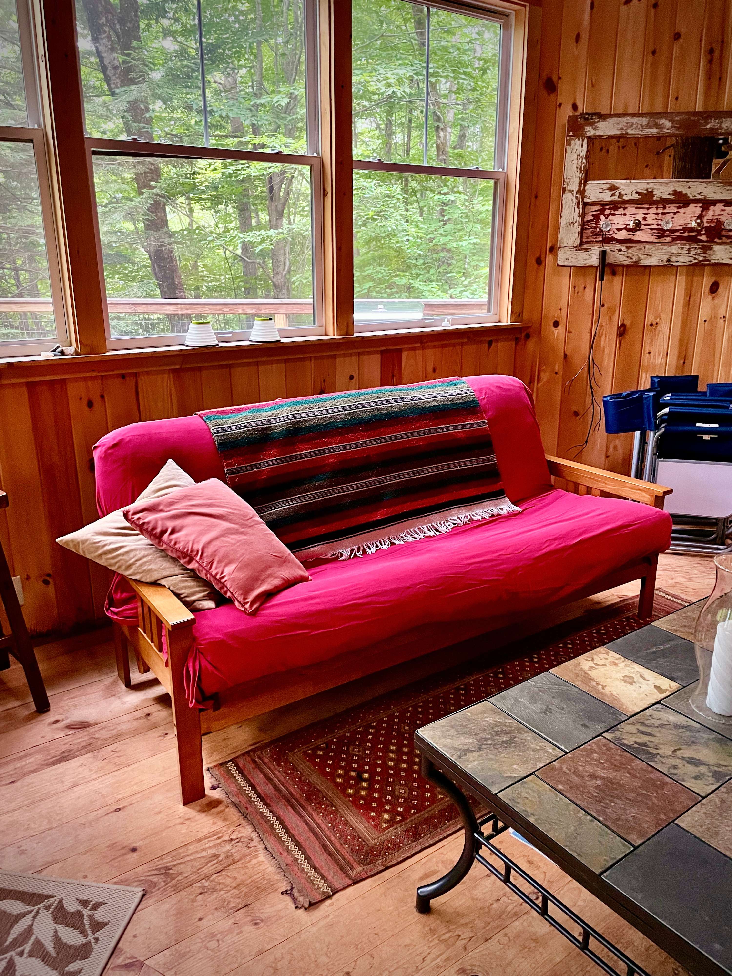 One of two full-size futons in the living room.