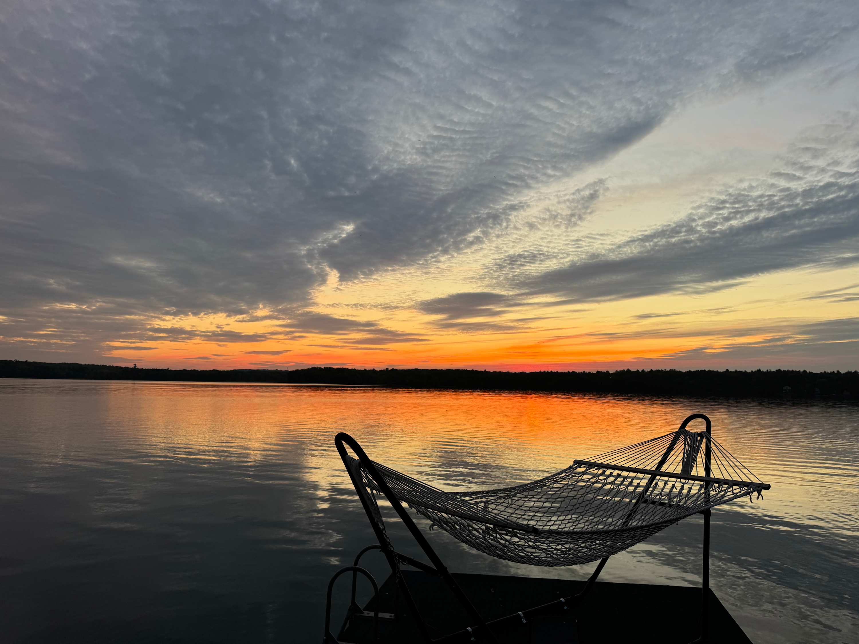 Relax in the view from the self-rocking hammock swim dock.