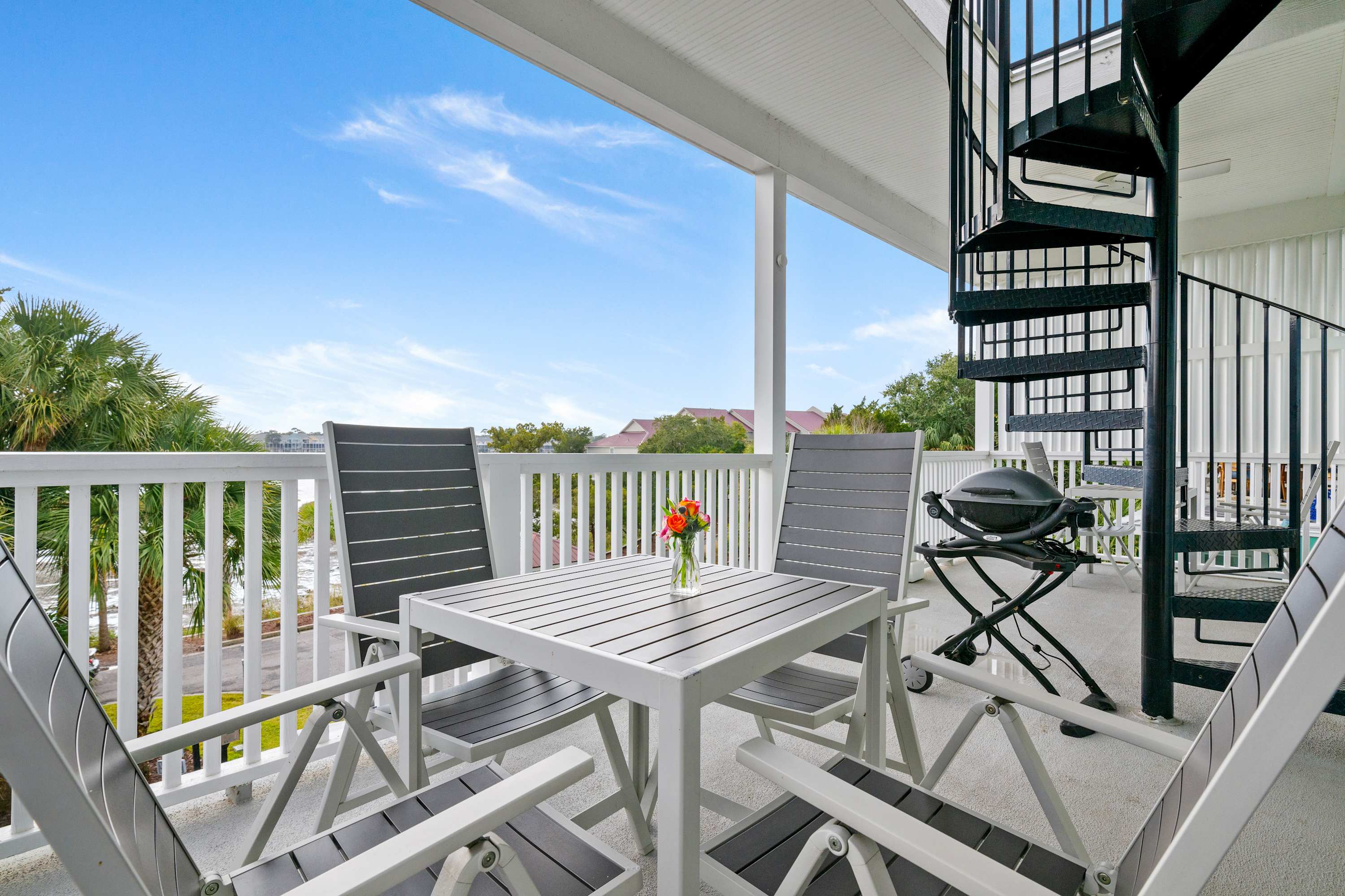 Balcony seating and spiral staircase up to the rooftop! 