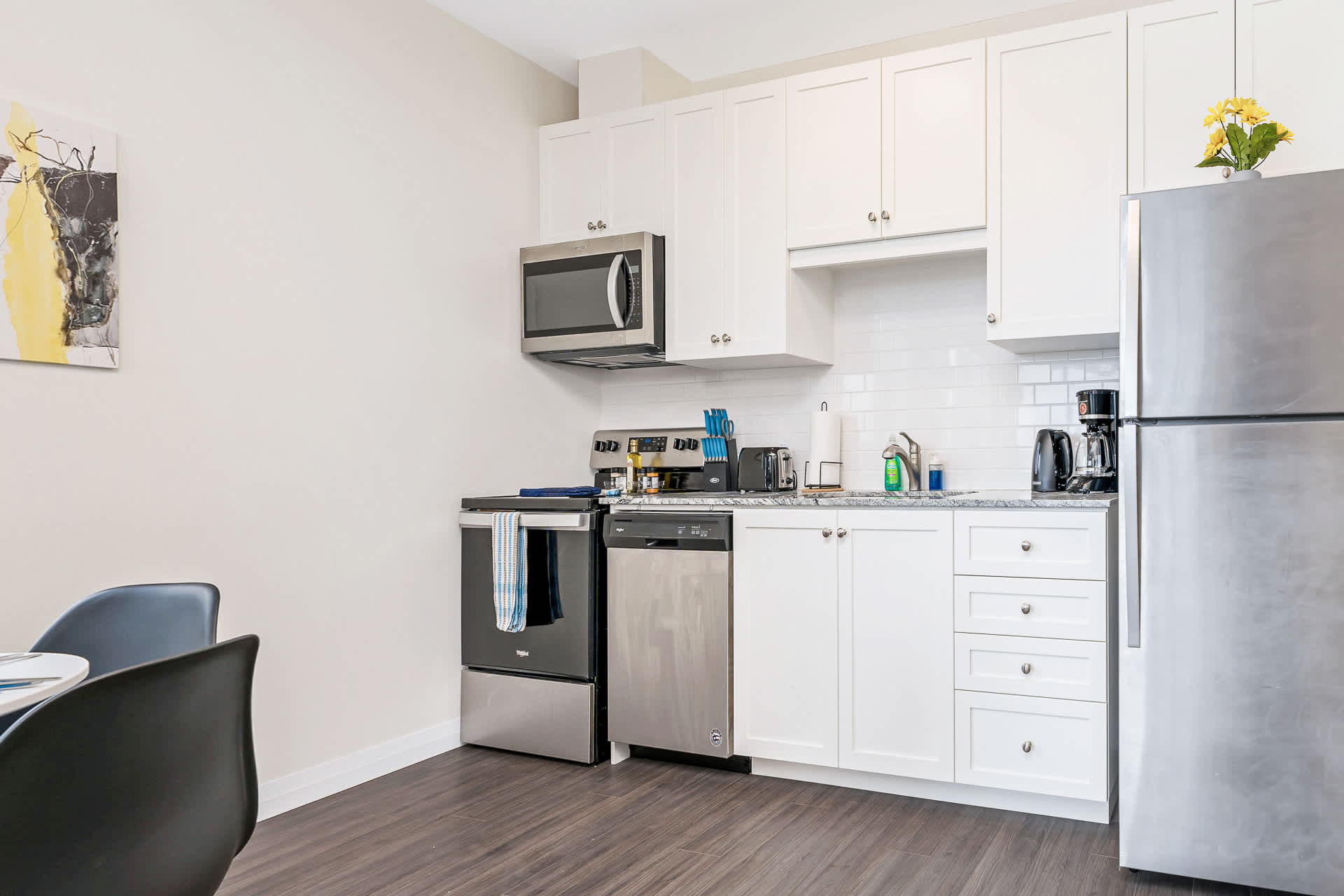 Fully equipped kitchen with silver appliances