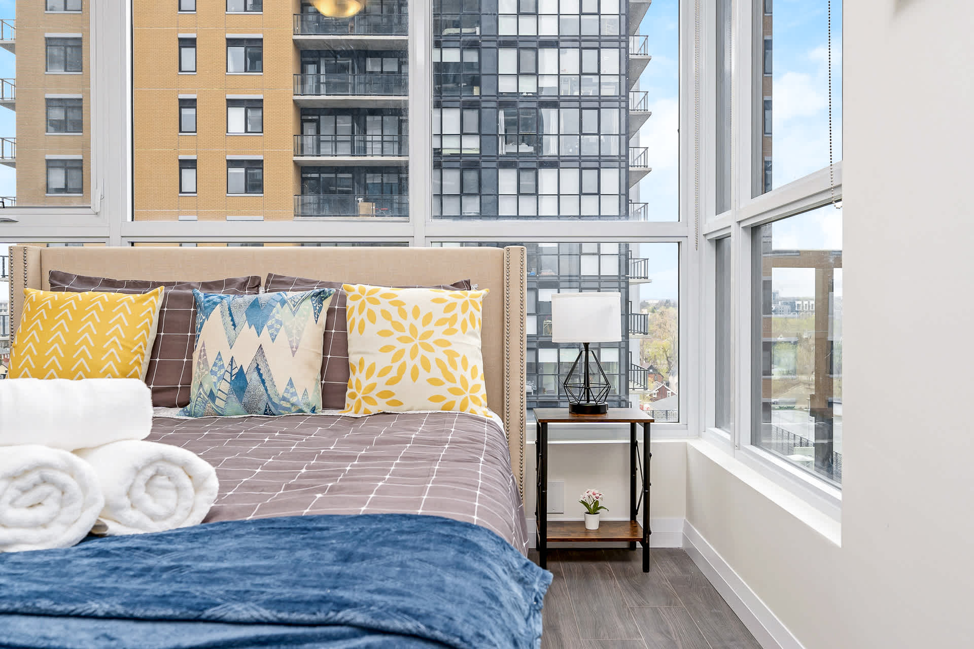 Queen bedroom with large windows