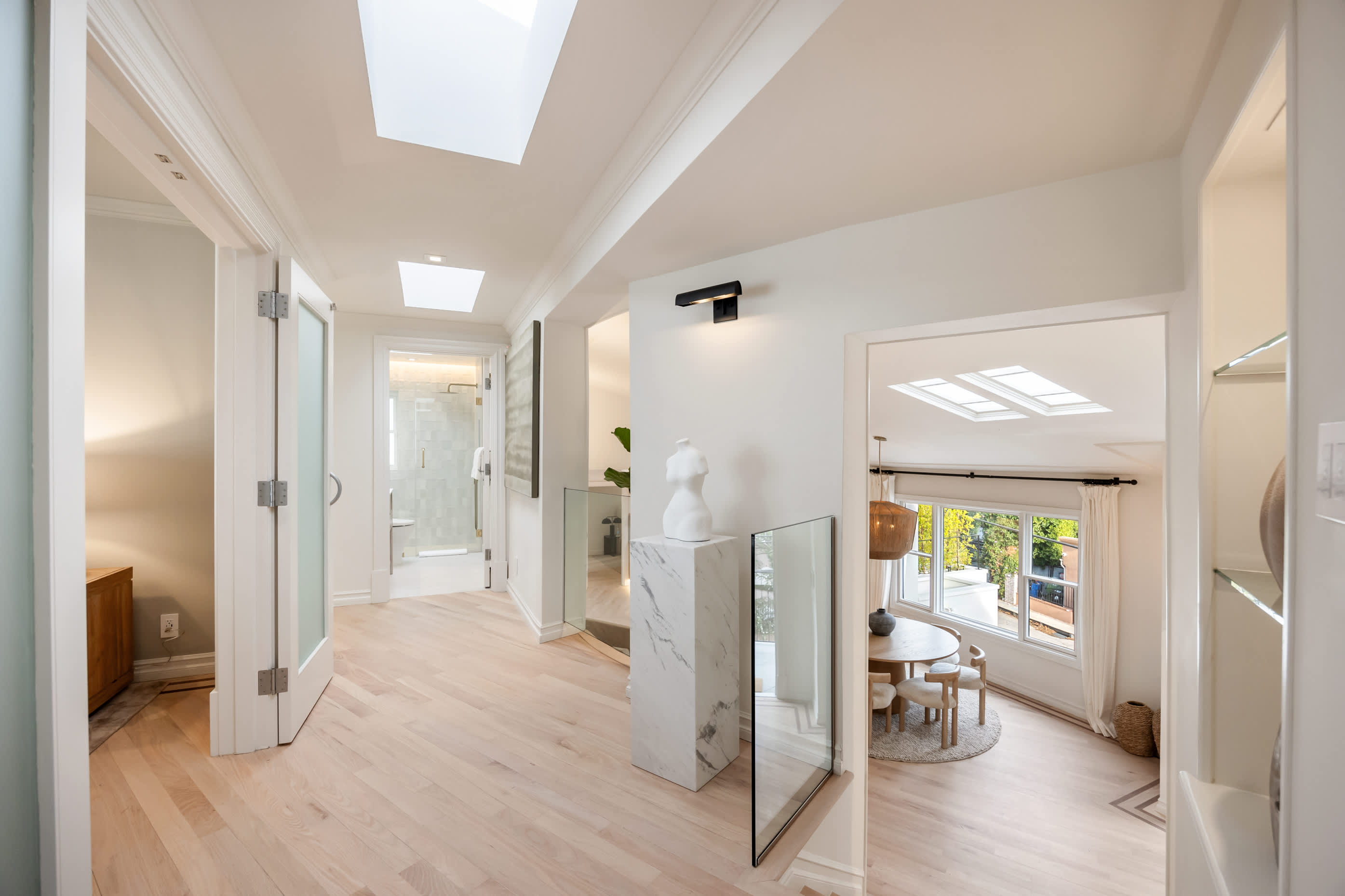 A bright and open hallway crafted to inspire seamless flow and refined living.
