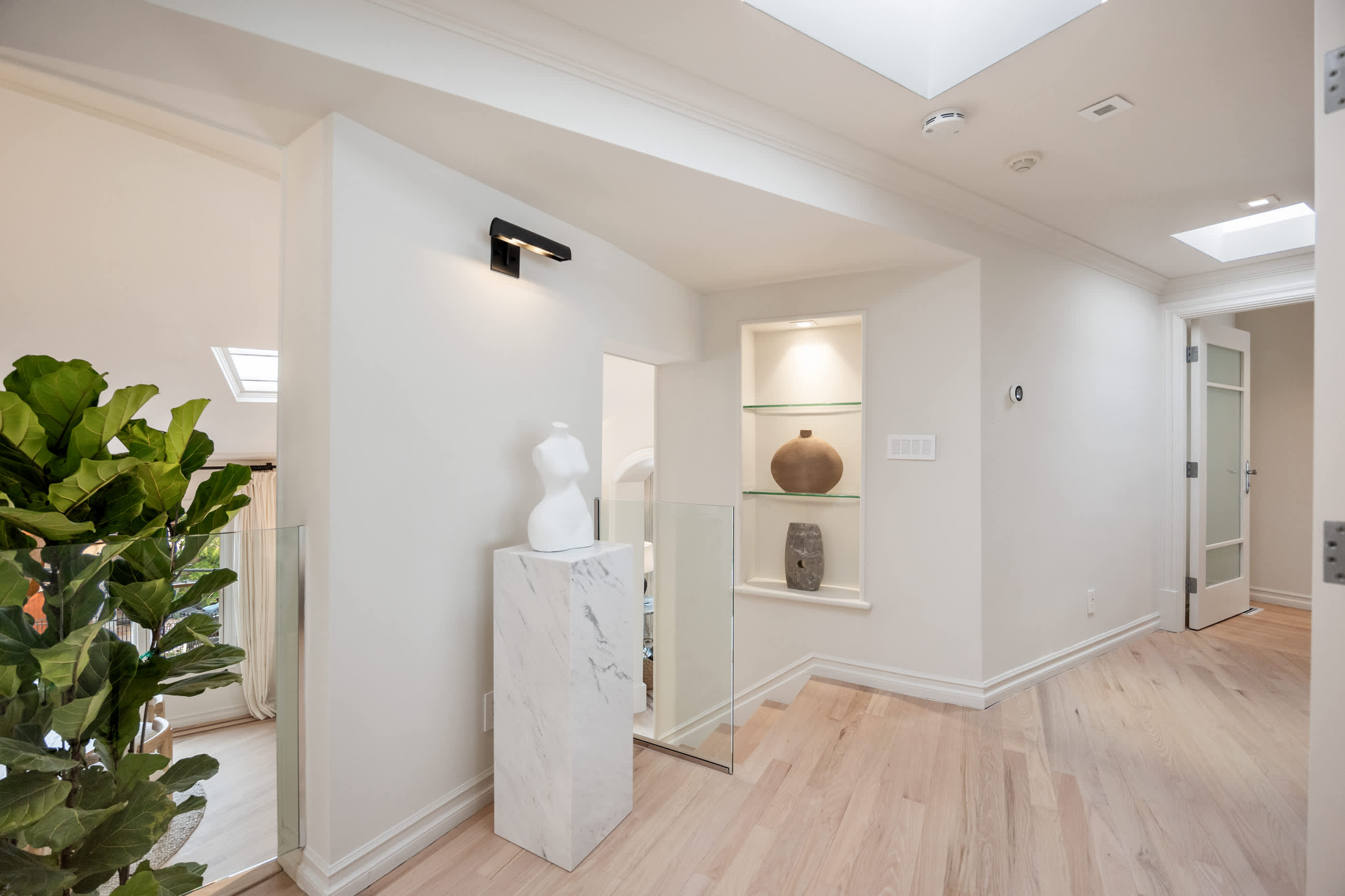 Step into a space where natural light and artful details set the tone.