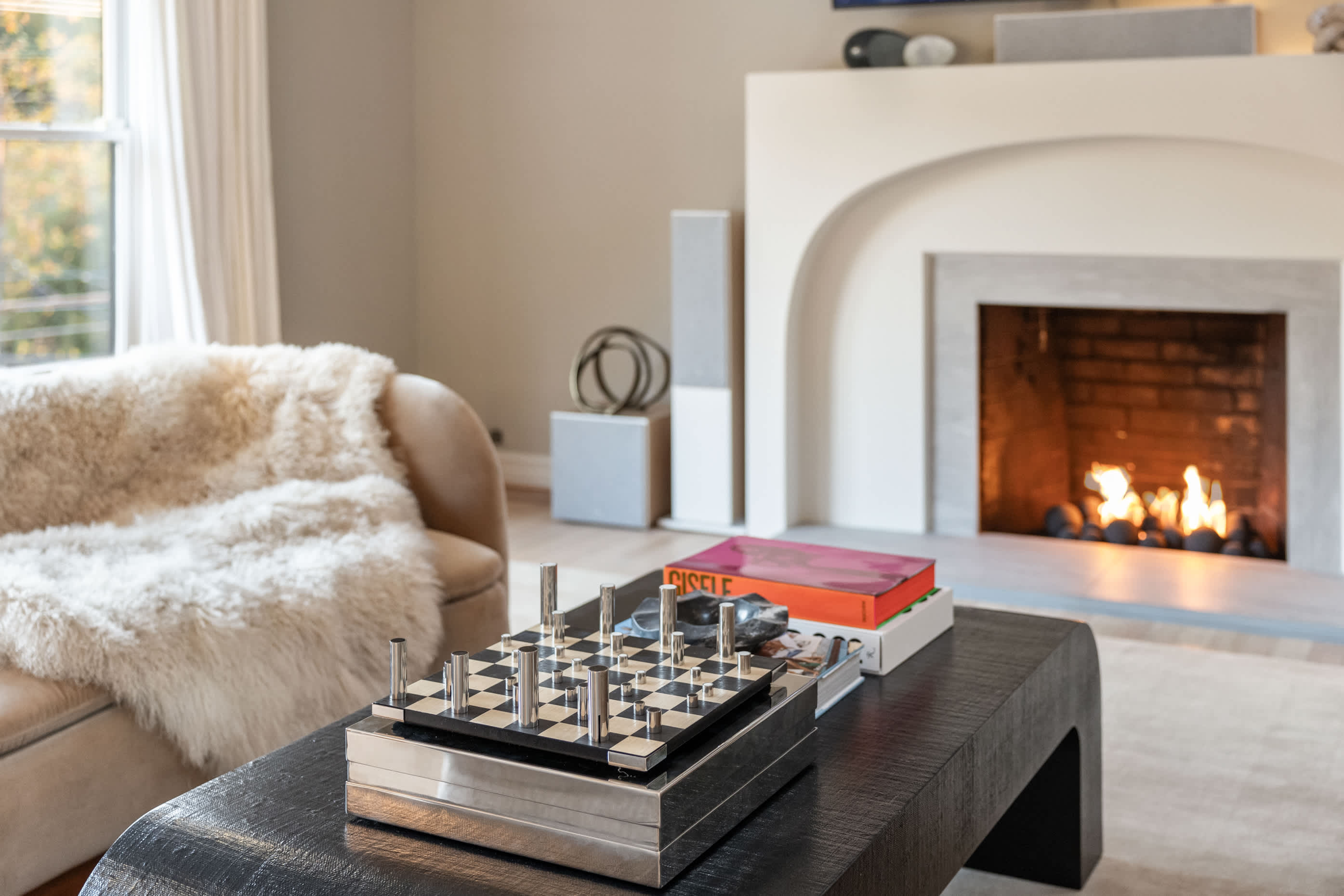 Cozy moments by the fireplace, surrounded by timeless charm and curated comfort.