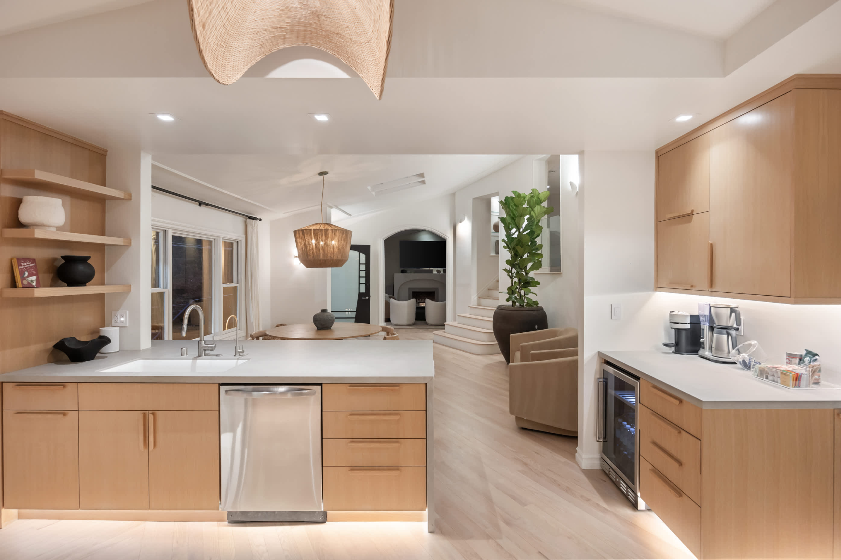 The heart of the home offers sleek finishes, warm wood tones, and inviting flow.