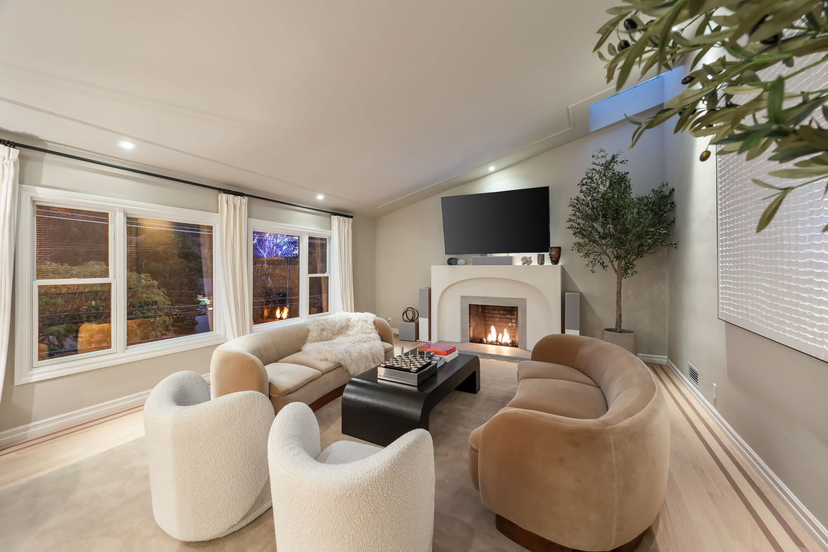 Cozy up by the fireplace for timeless comfort.
