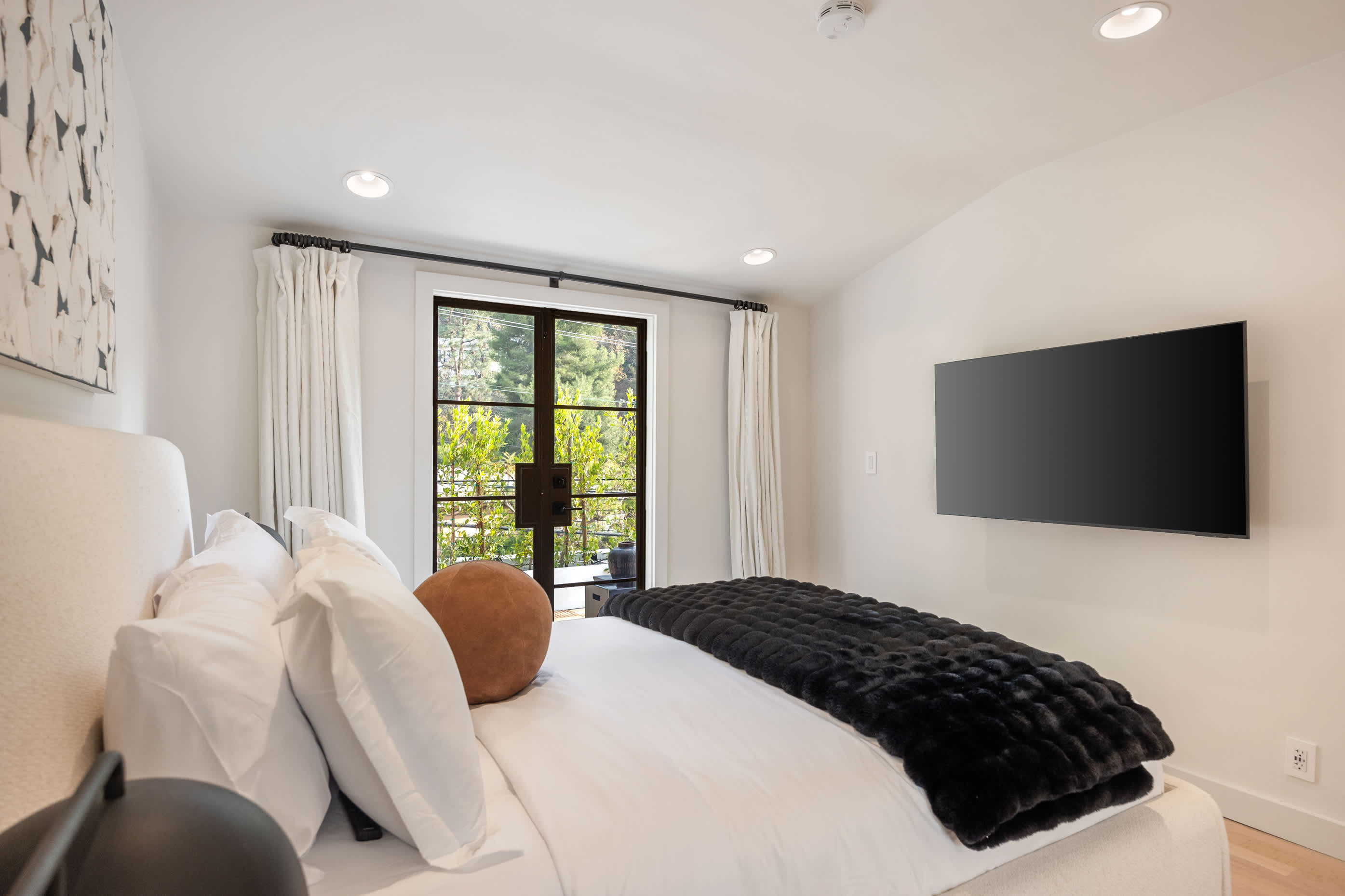 Featuring blackout shades, luxurious linens, and lush garden views.