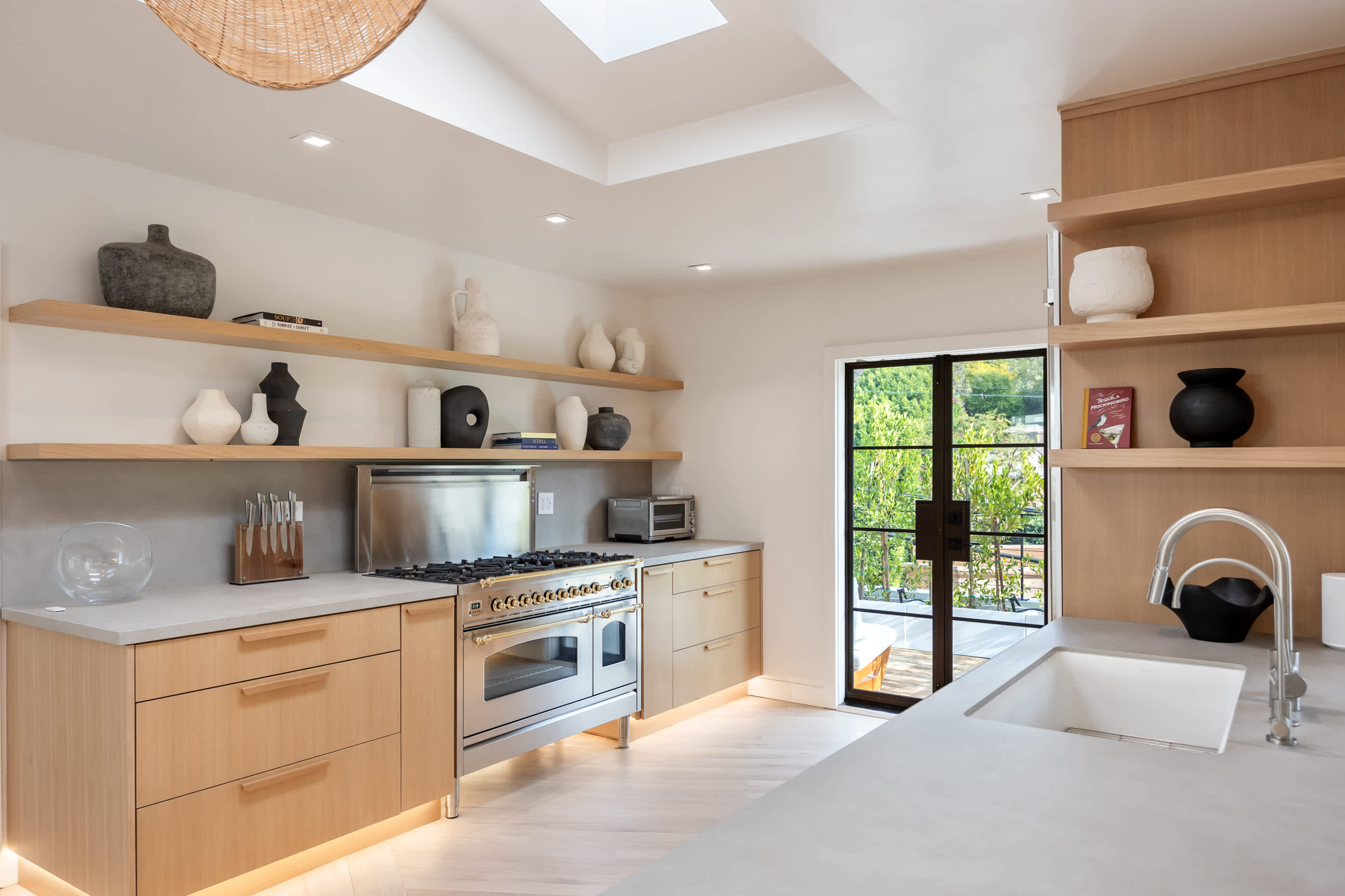 Designer appliances and wooden details come together in a kitchen crafted to inspire.