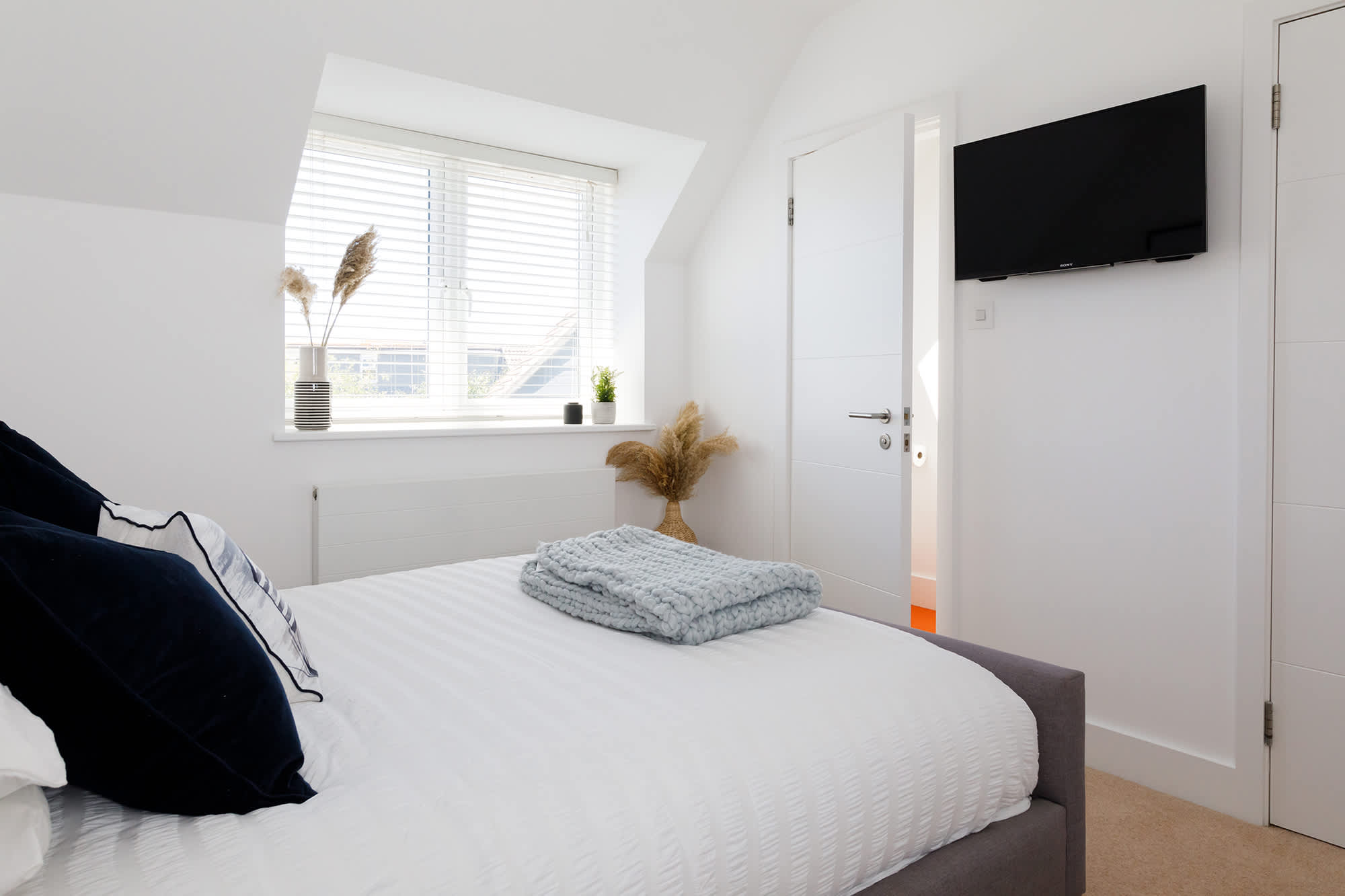 An abundance of carefully picked details create a unique bedroom ambiance