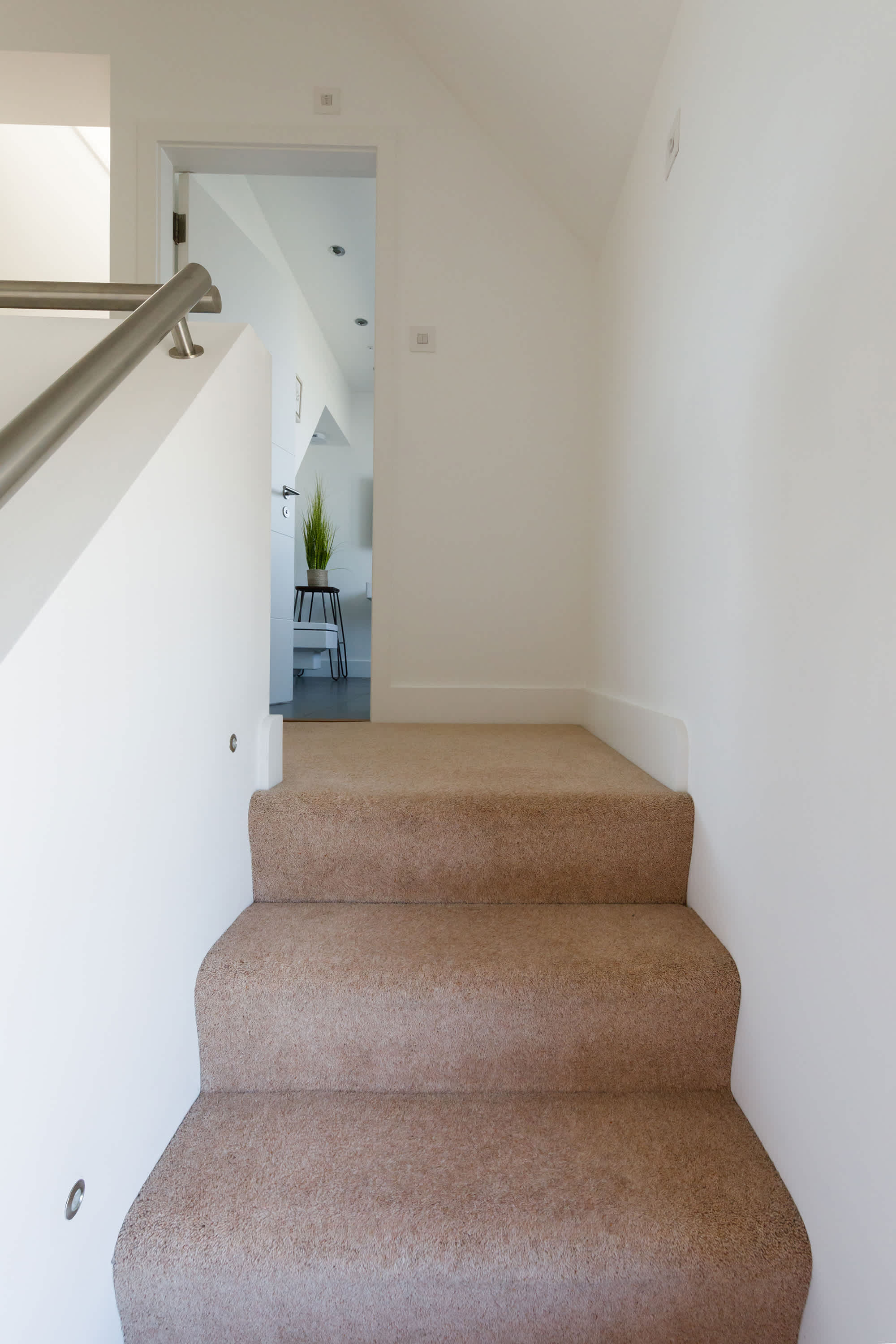 A few easy steps lead to the attic bedroom