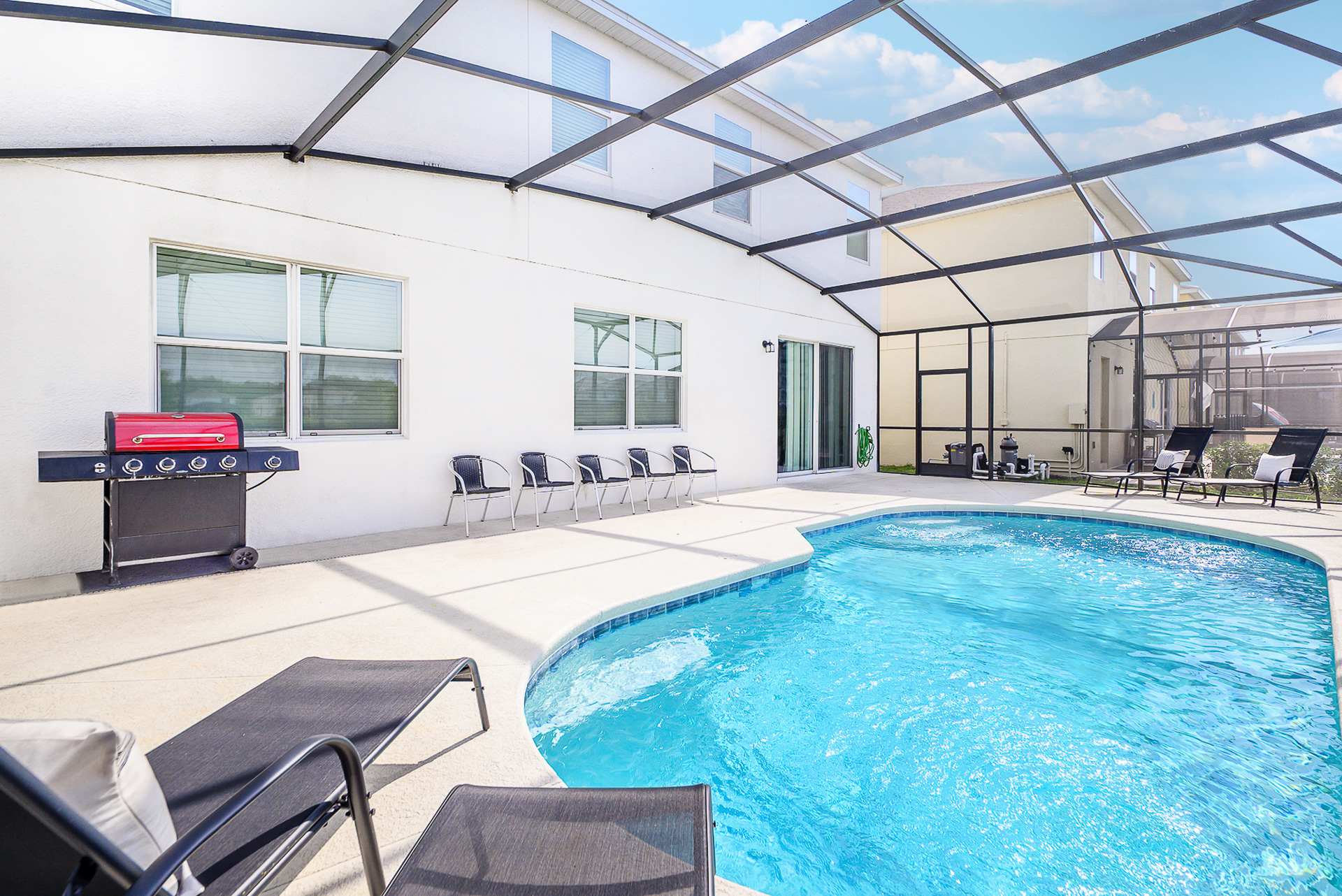 Private Outdoor Pool Area with BBQ Grill & Poolside Seating