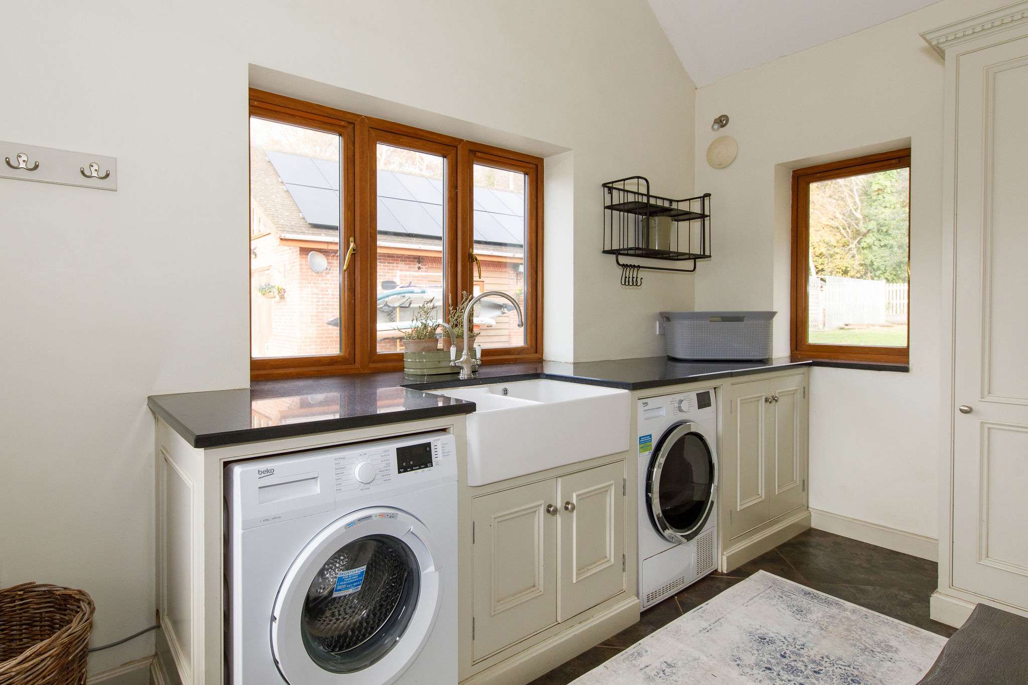 There is a downstairs utility room with all the essential appliances you need to keep on top of washing.