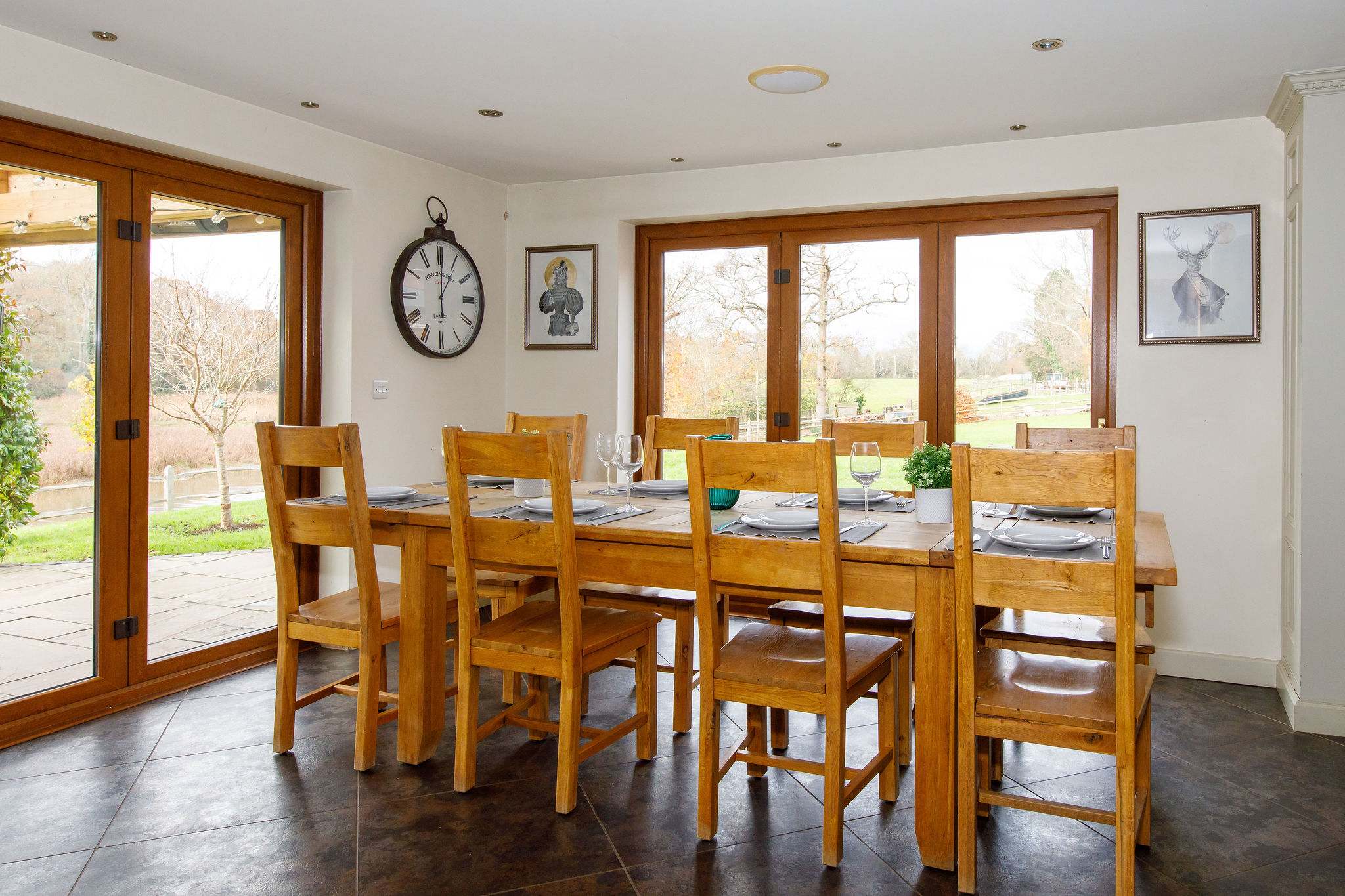 The dining area has wonderful views across the gardens and beyond to the surrounding countryside and lake.