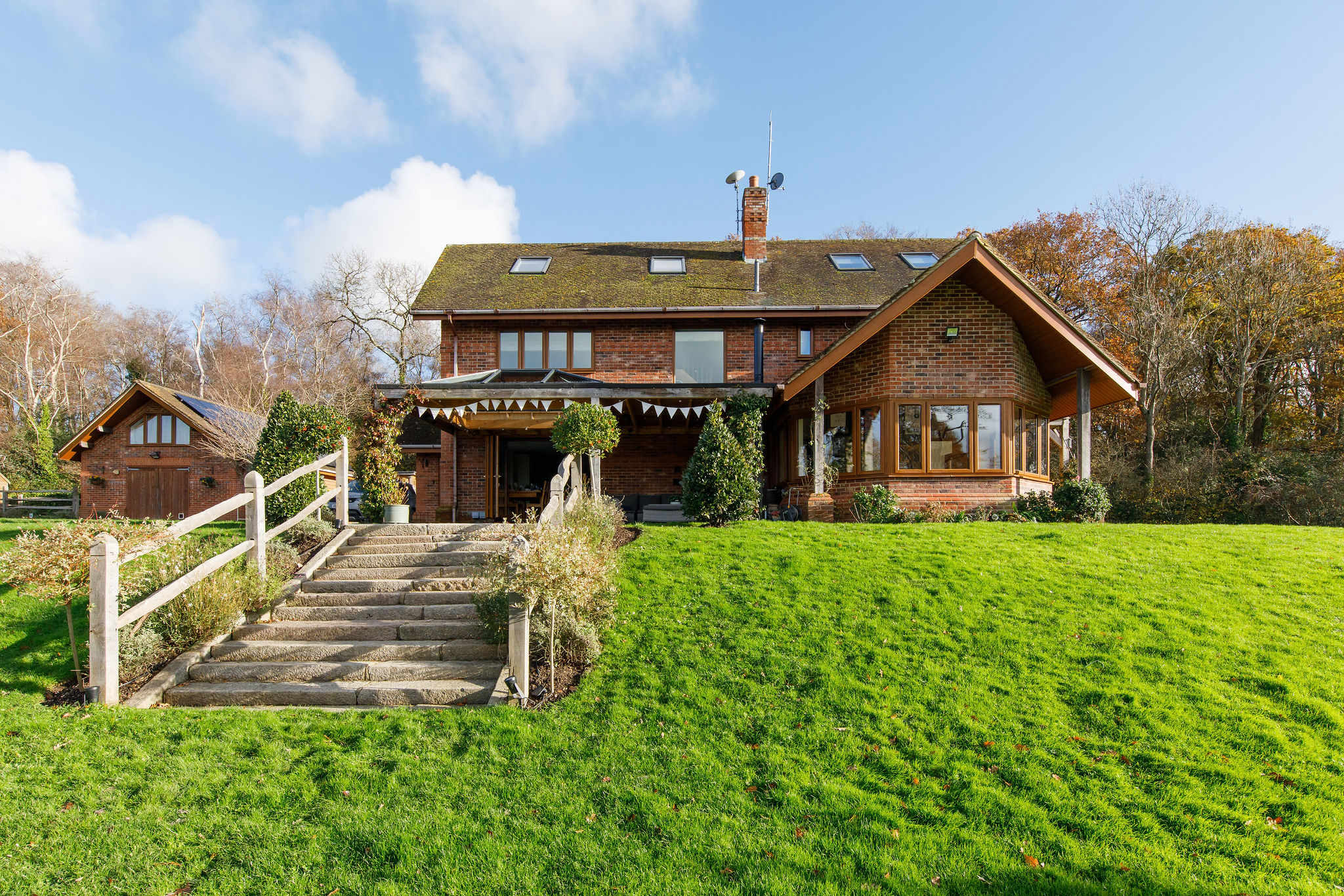 This 4000 sq ft retreat is designed to offer a unique blend of modern elegance and serene riverfront living.